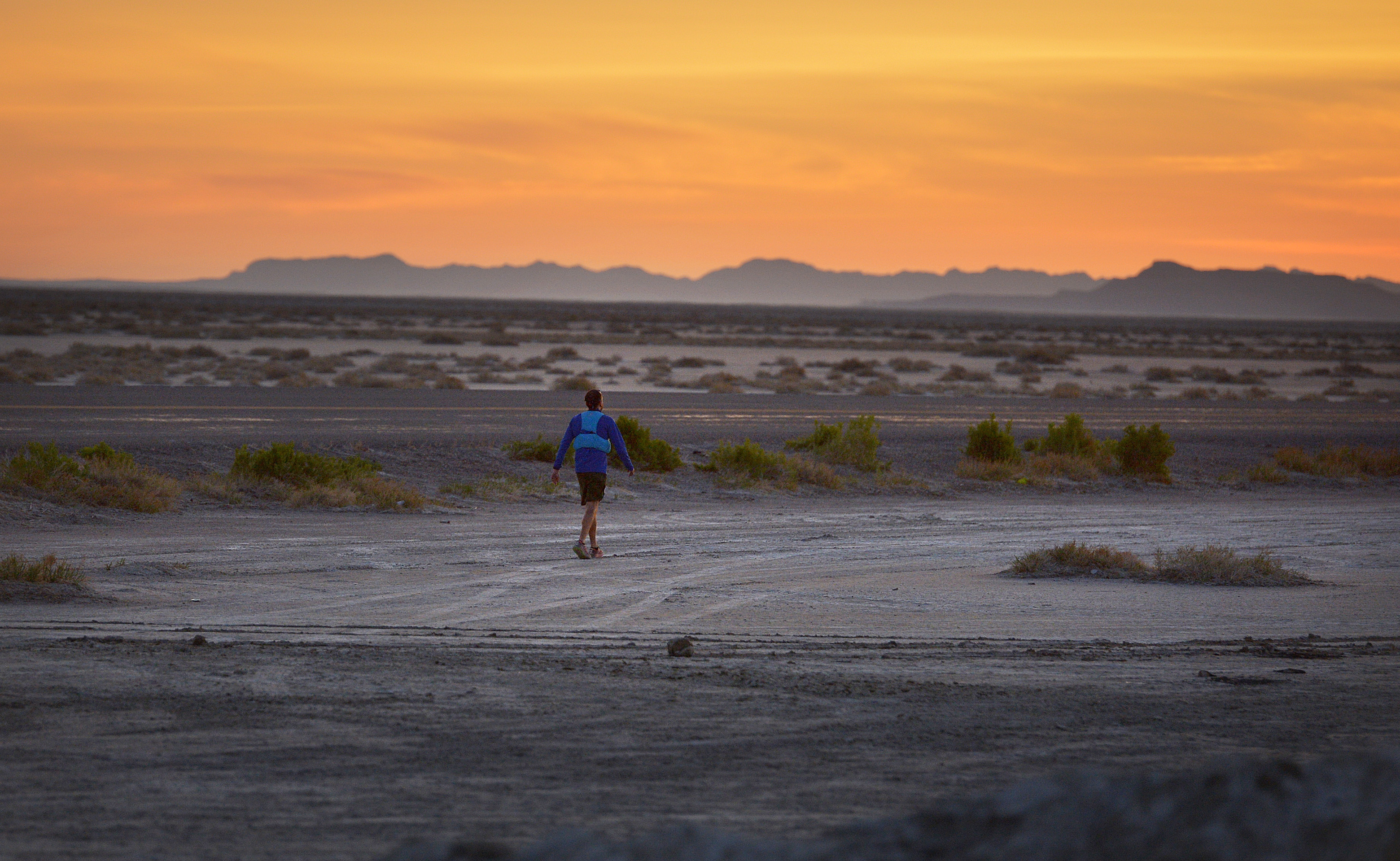 (Scott Sommerdorf | The Salt Lake Tribune) Alex Doolan sets out on the last 3.8 miles as the sun rises at the Salt Flats 100 Endurance Run, Saturday, May 5, 2018. Doolan finished the race in 8th place. 