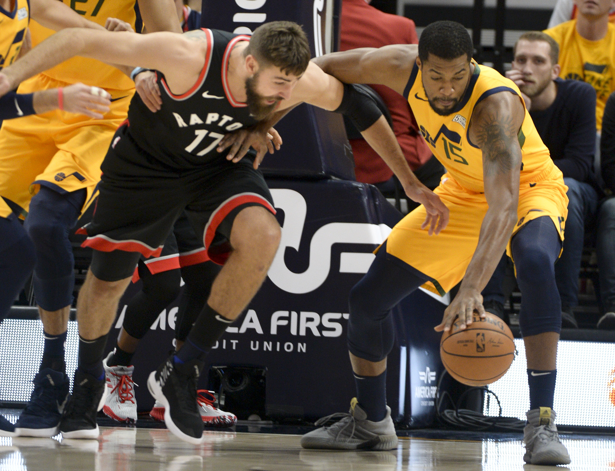 Leah Hogsten | The Salt Lake Tribune Utah Jazz forward Derrick Favors (15) grabs the rebound over Toronto Raptors center Greg Monroe (15) as the Utah Jazz host the Toronto Raptors, Monday, Nov. 5, 2018 at Vivant Smart Home Arena.