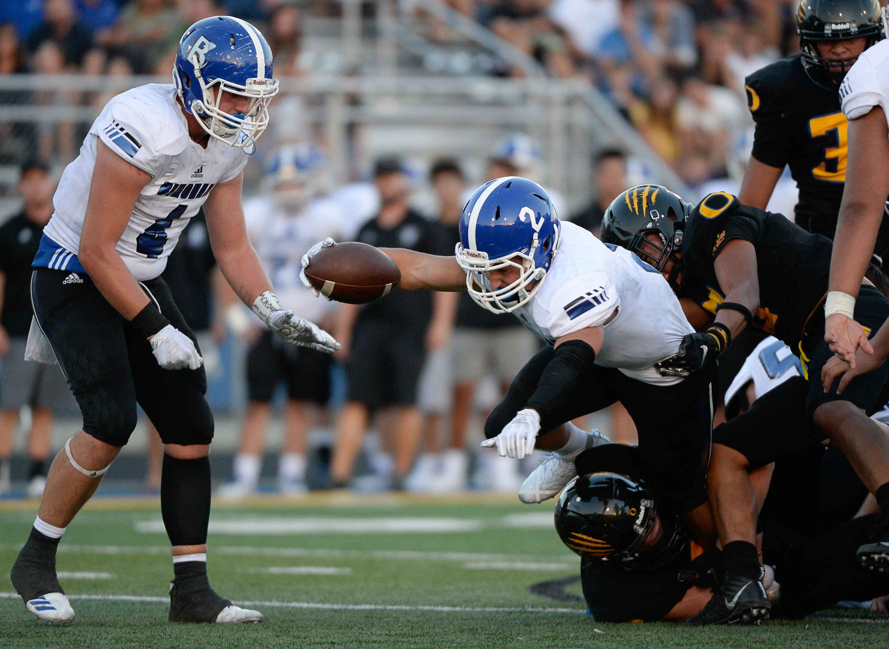 (Francisco Kjolseth | The Salt Lake Tribune) Bingham's Andrew Wimmer pushes past the Orem defense, Thursday, Aug. 16, 2018 in Orem.