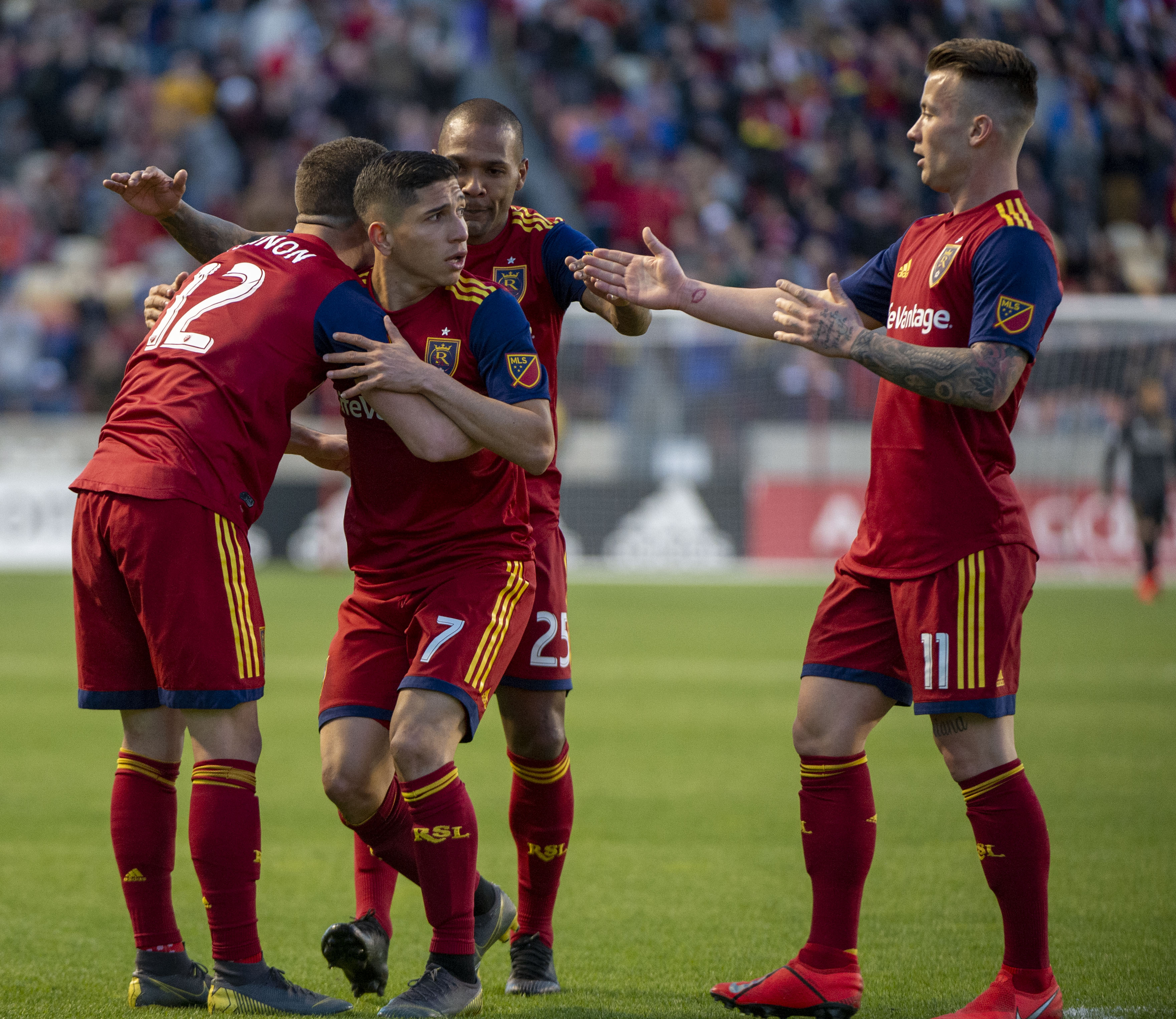 (Rick Egan | The Salt Lake Tribune) Real Salt Lake forward Brooks Lennon (12) Real Salt Lake midfielder Everton Luiz (25) and Real Salt Lake midfielder Albert Rusnak (11) congratulate Real forward Jefferson Savarino (7) after he scored a goal for Salt Lake, at Rio Tinto Stadium, Saturday, March 30, 2019. 