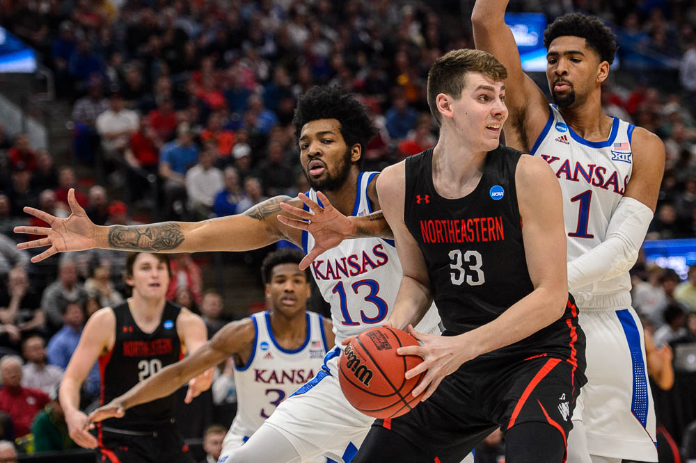 (Trent Nelson | The Salt Lake Tribune) Northeastern Huskies forward Tomas Murphy (33) defended by Kansas Jayhawks guard K.J. Lawson (13) and Kansas Jayhawks forward Dedric Lawson (1) as Kansas faces Northeastern in the 2019 NCAA Tournament in Salt Lake City on Thursday March 21, 2019.