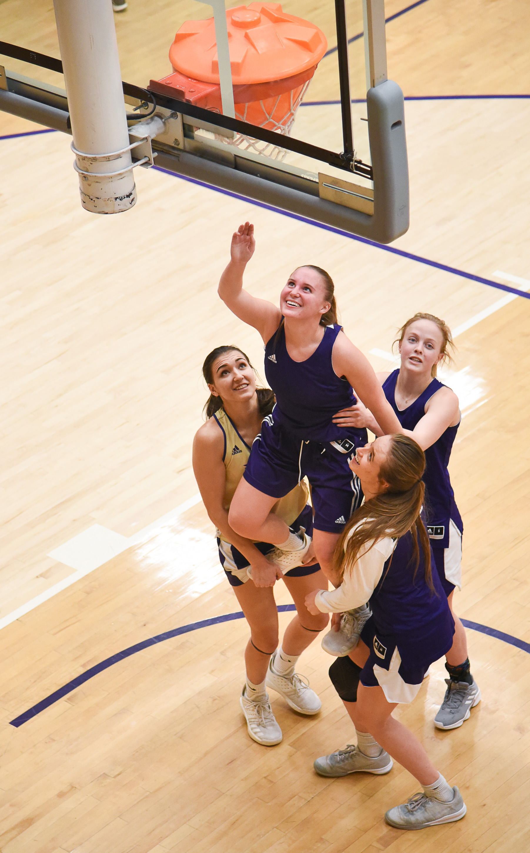 (Francisco Kjolseth | The Salt Lake Tribune) Jessica Perry is lifted by teammates as they remove a training tool from the basket during a practice in the Behnken Field House on Tuesday, Ja. 29, 2019. 