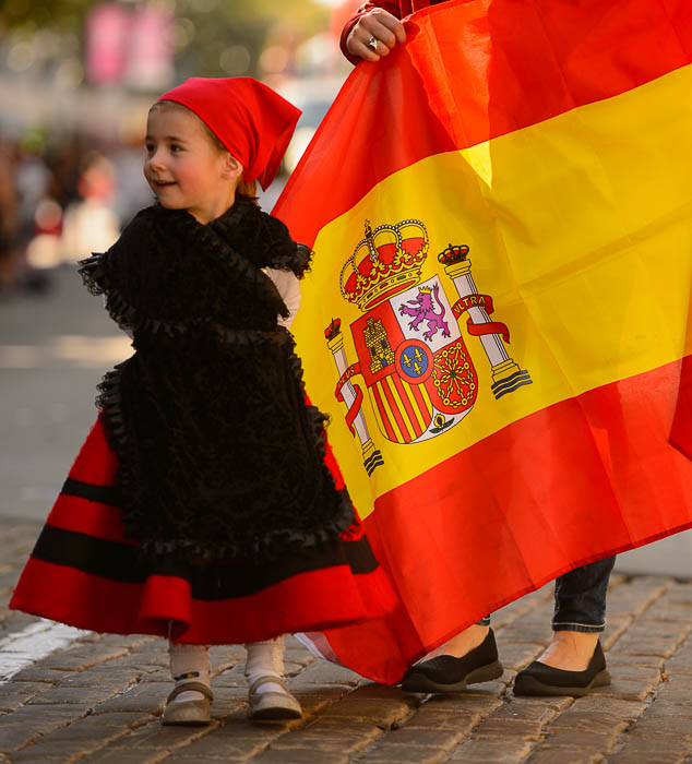 (Trent Nelson | The Salt Lake Tribune) Olaia Slonaker Trillo and the Spanish flag in the third annual Hispanic Heritage Parade and Street Festival in Salt Lake City, Saturday Sept. 22, 2018.