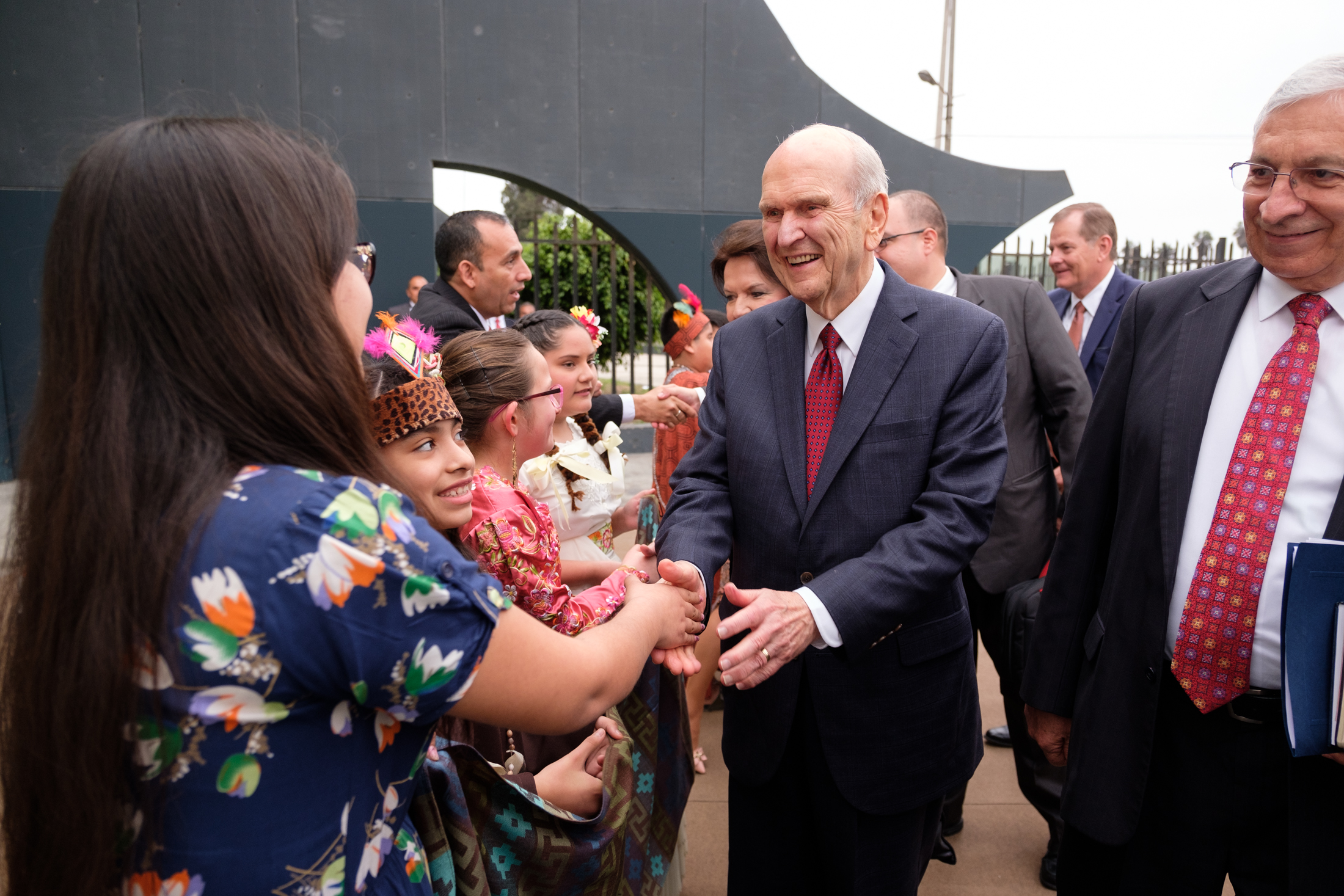(Courtesy photo | The Church of Jesus Christ of Latter-day Saints) Young Latter-day Saints in traditional costume in Peru greet President Russell M. Nelson before he speaks at a devotional Oct. 20, 2018.