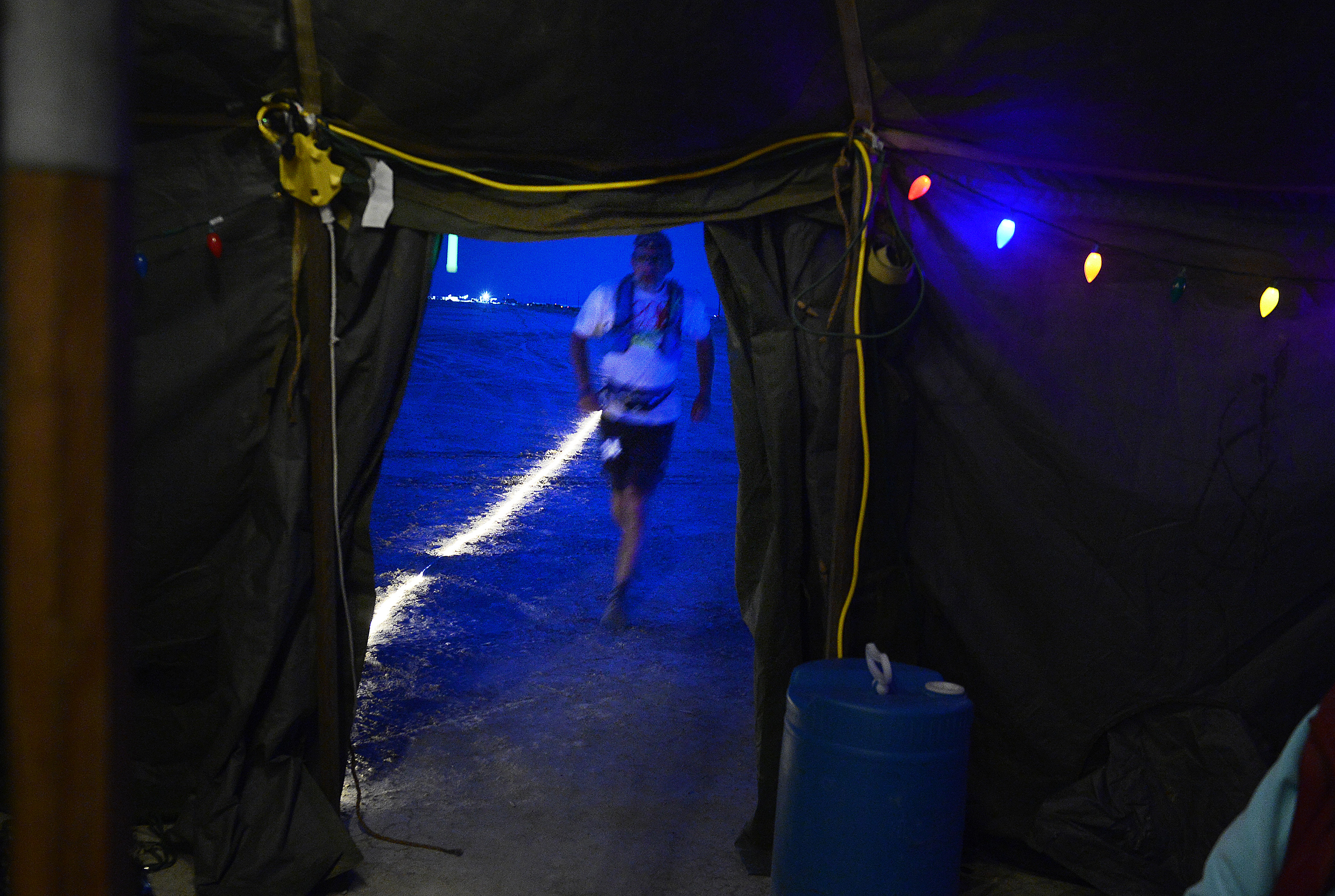 (Scott Sommerdorf | The Salt Lake Tribune) Seventh place finisher Todd Vogel approaches Aid Station 14 - the last checkpoint before the finish line - at the Salt Flats 100 Endurance Run, Saturday, May 5, 2018. 
