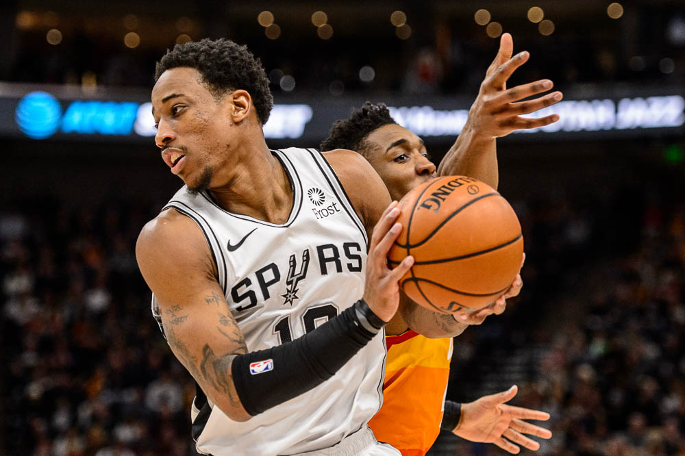 (Trent Nelson | The Salt Lake Tribune) Utah Jazz guard Donovan Mitchell (45) goes for the steal but San Antonio Spurs guard DeMar DeRozan (10) holds onto the ball as the Utah Jazz host the San Antonio Spurs, NBA basketball in Salt Lake City on Saturday Feb. 9, 2019.