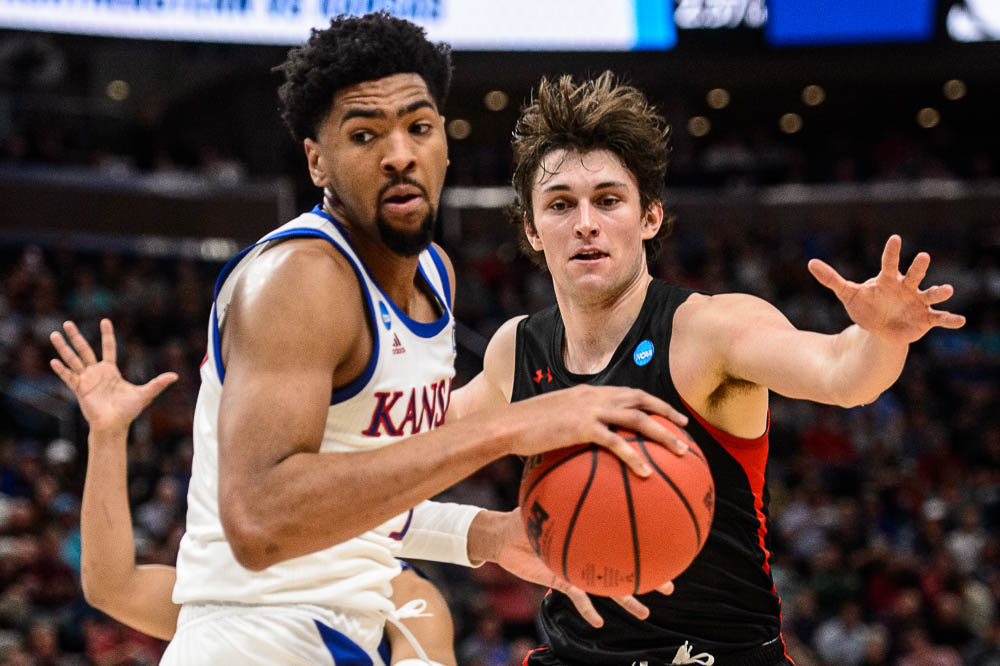 (Trent Nelson | The Salt Lake Tribune) Kansas Jayhawks forward Dedric Lawson (1) and Northeastern Huskies guard Bolden Brace (20) as Kansas faces Northeastern in the 2019 NCAA Tournament in Salt Lake City on Thursday March 21, 2019.