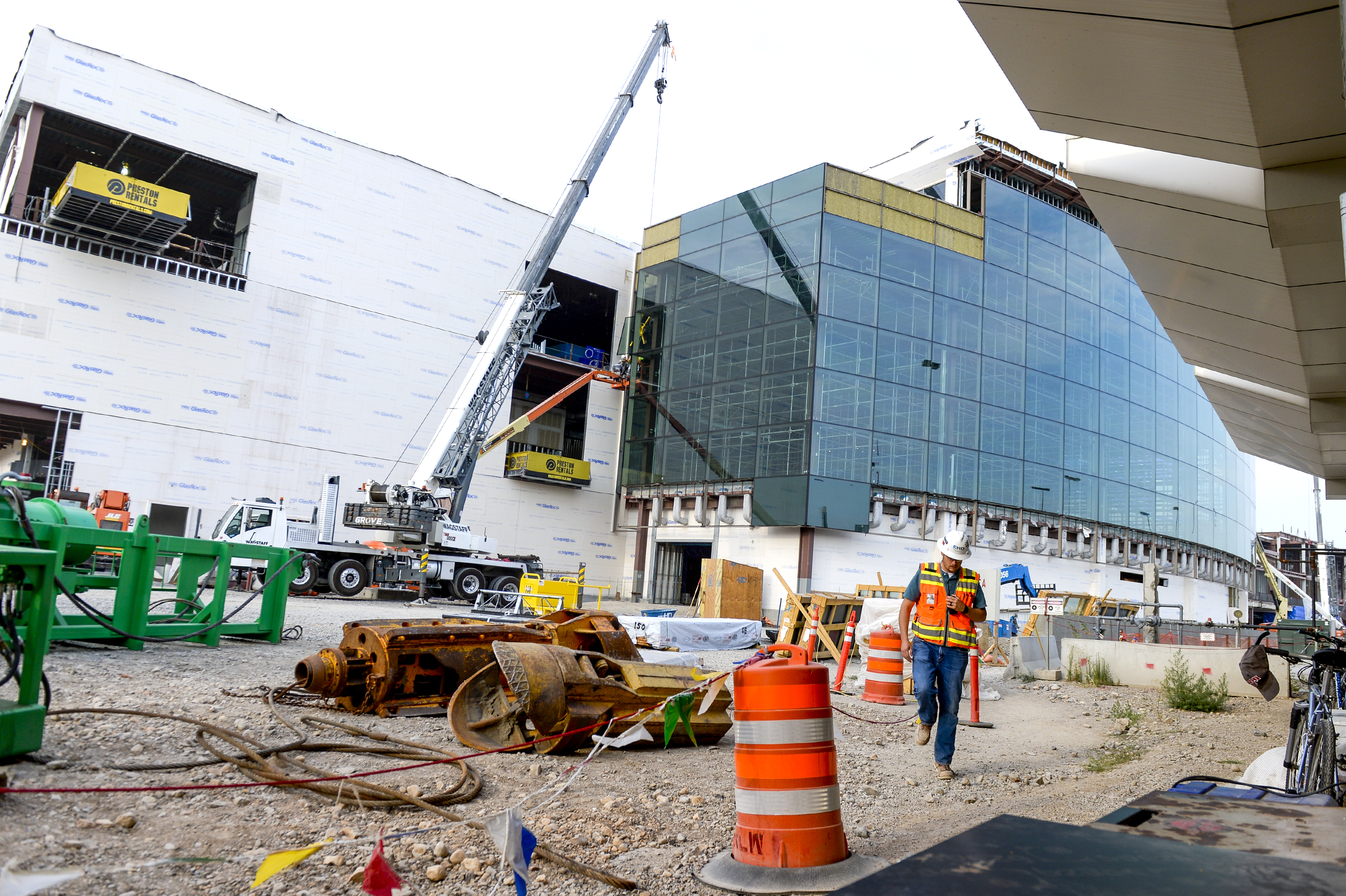 Leah Hogsten | The Salt Lake Tribune Cameron Balfour walks amid Salt Lake City International Airport's first phase construction. The $3.6 billion project is hitting the halfway mark Ñ and large new buildings and elevated roadways are more easily seen. Nearing completion is the new concourse for aircraft gates, an enclosed new terminal, the steel skeleton of a new ÒgatewayÓ building, a new five-story parking garage and elevated roadways. 