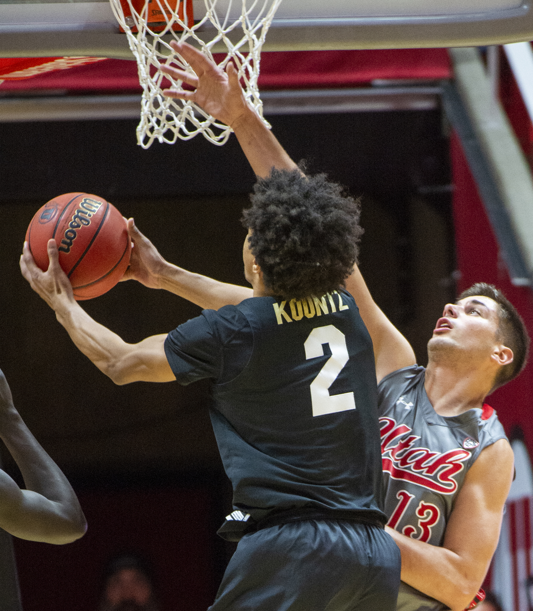 (Rick Egan | The Salt Lake Tribune) Colorado Buffaloes guard Daylen Kountz (2) goes up for a shot as Utah Utes forward Novak Topalovic (13) defends, in PAC-12 basketball action between the Utah Utes and the Colorado Buffaloes at the Jon M. Huntsman Center, Sunday, Jan. 20, 2019. 
