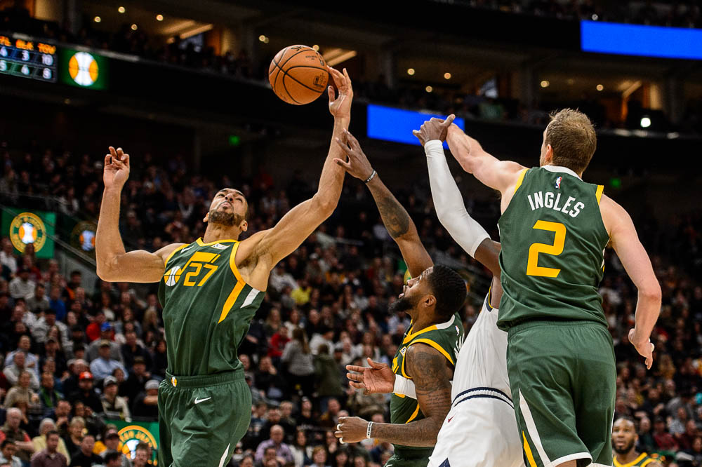 (Trent Nelson | The Salt Lake Tribune) Utah Jazz center Rudy Gobert (27) pulls in a rebound as the Utah Jazz host the Denver Nuggets, NBA basketball in Salt Lake City on Wednesday Jan. 23, 2019.