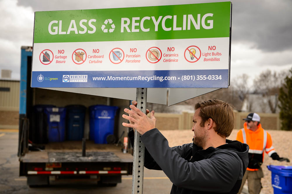 (Trent Nelson | The Salt Lake Tribune) Jason Utgaard and Michael Gibbs of Momentum Recycling install a glass recycling station at the State Wine Store in Salt Lake City on Tuesday, Feb. 6, 2018.