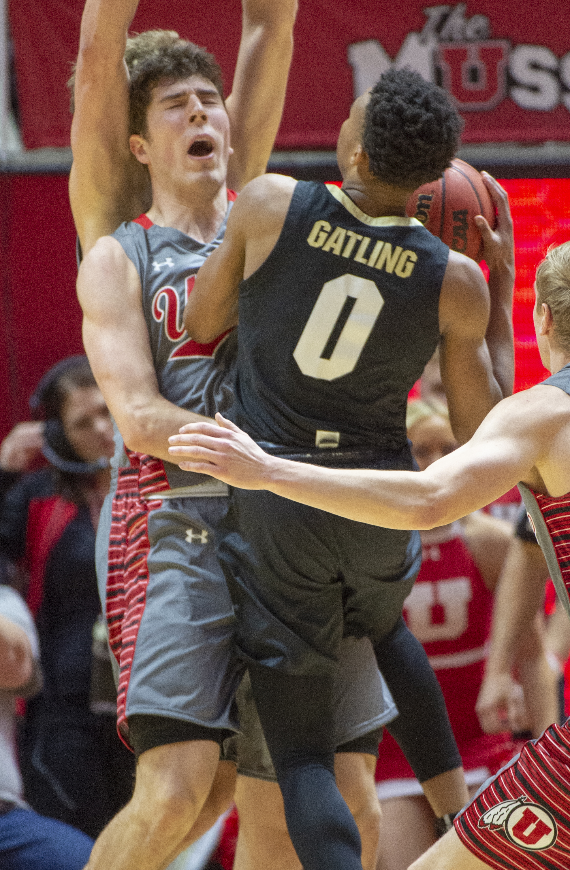 (Rick Egan | The Salt Lake Tribune) Utah Utes forward Riley Battin (21) is called for a fouled as he collides with Colorado Buffaloes guard Shane Gatling (0), in PAC-12 basketball action between the Utah Utes and the Colorado Buffaloes at the Jon M. Huntsman Center, Sunday, Jan. 20, 2019. 