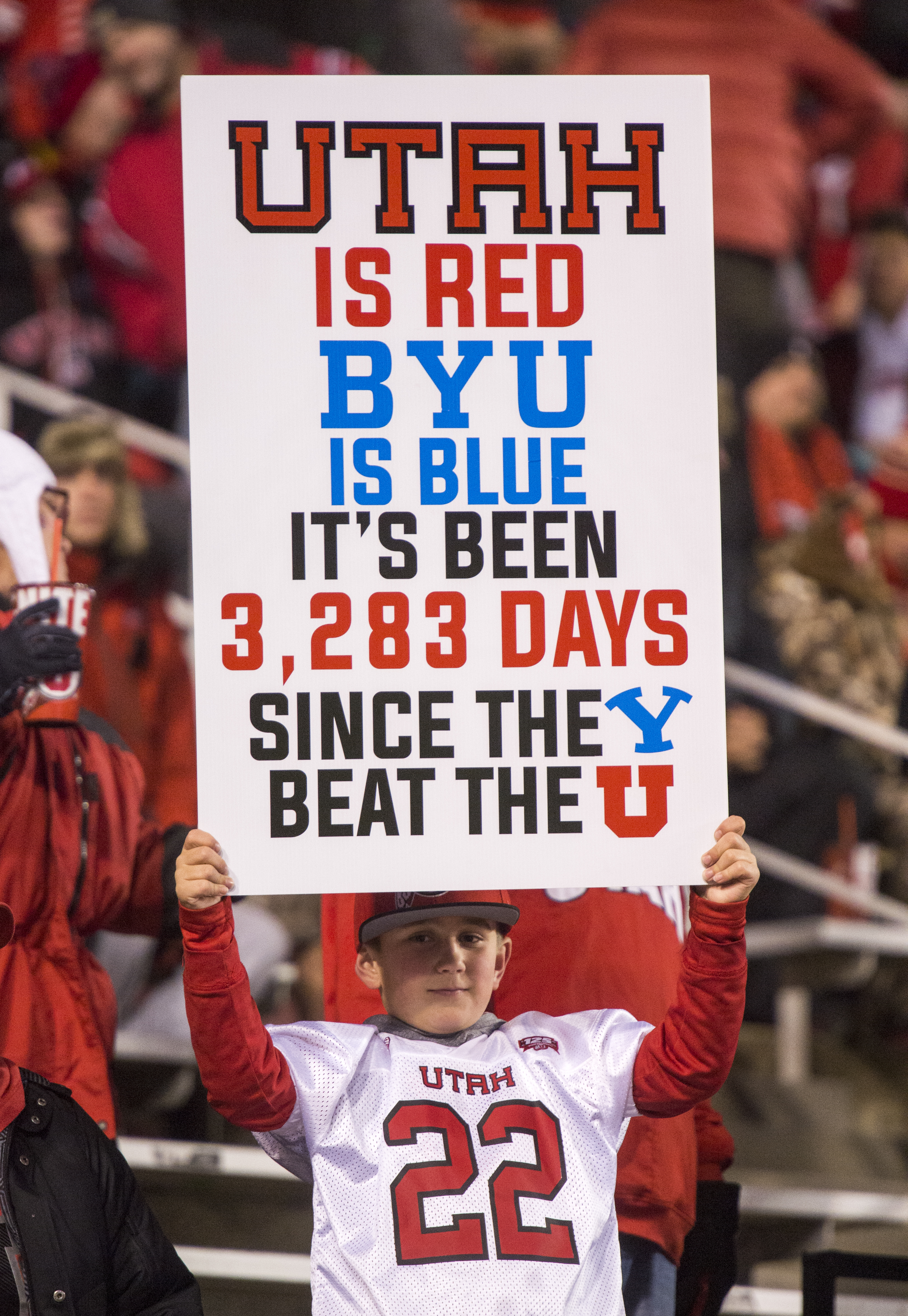 (Rick Egan | The Salt Lake Tribune) Alton Dahl, 9, from Farmington, holds a sign before football action between the Brigham Young Cougars and the Utah Utes, at Rice-Eccles Stadium, Saturday, November 24, 2018. 