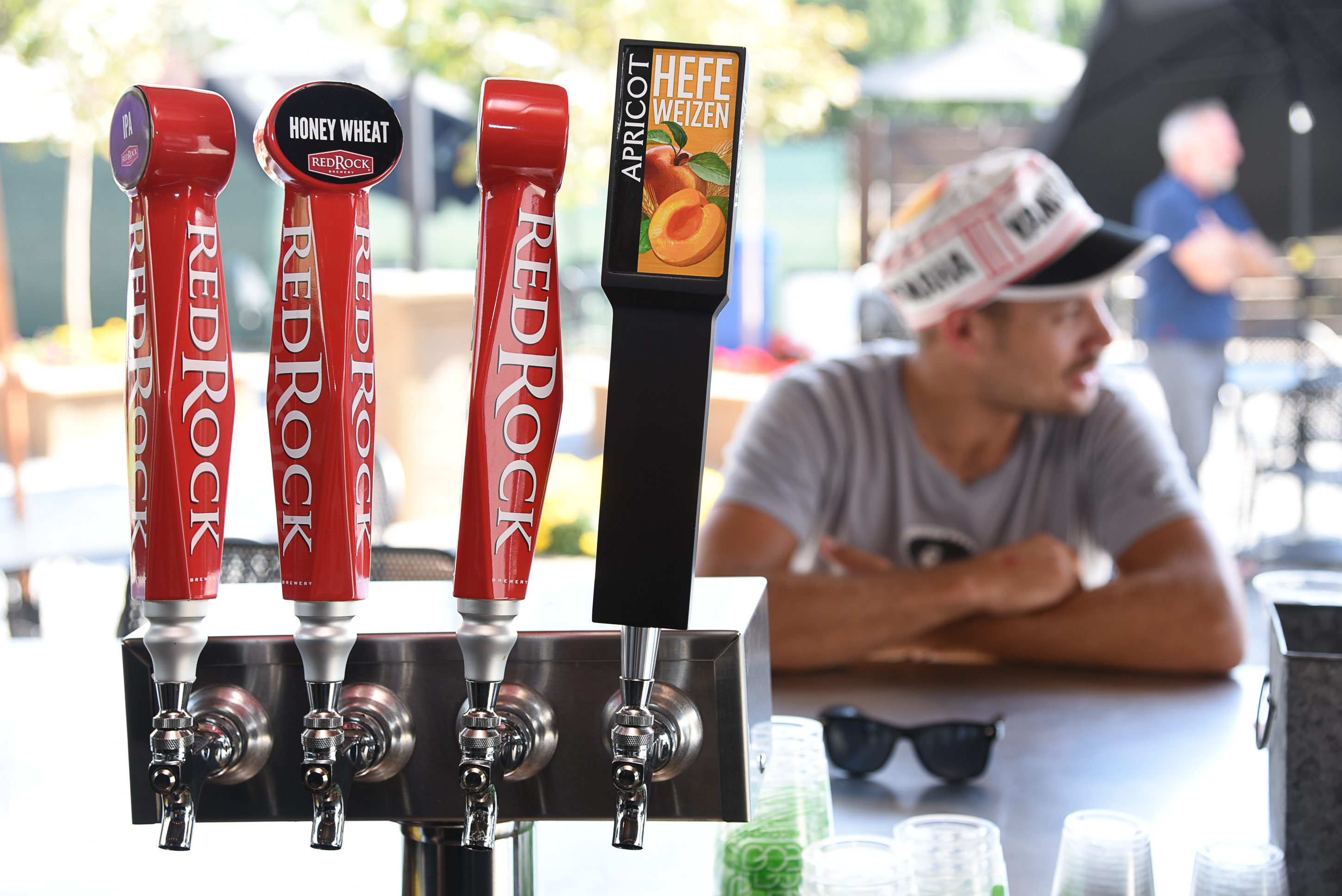 (Francisco Kjolseth | The Salt Lake Tribune) Ben Kuechenmeister enjoys a beer at The Garten on Friday, Sept. 7, 2018. Jeff and Jennifer Carleton, owners of The Garten, a new German-inspired beer garden in Salt Lake City are having a difficult time getting a permanent liquor license from the DABC. They don't qualify for a restaurant liquor license, because the venue doesnÕt have an on-site kitchen. They were denied a reception center license because they need to serve more than just offerings from food trucks. A bar license is an option, but the CarletonÕs would prefer to keep The Garten an all-ages venue, so that parents can bring their minor children. Right now they are operating on special event permits.