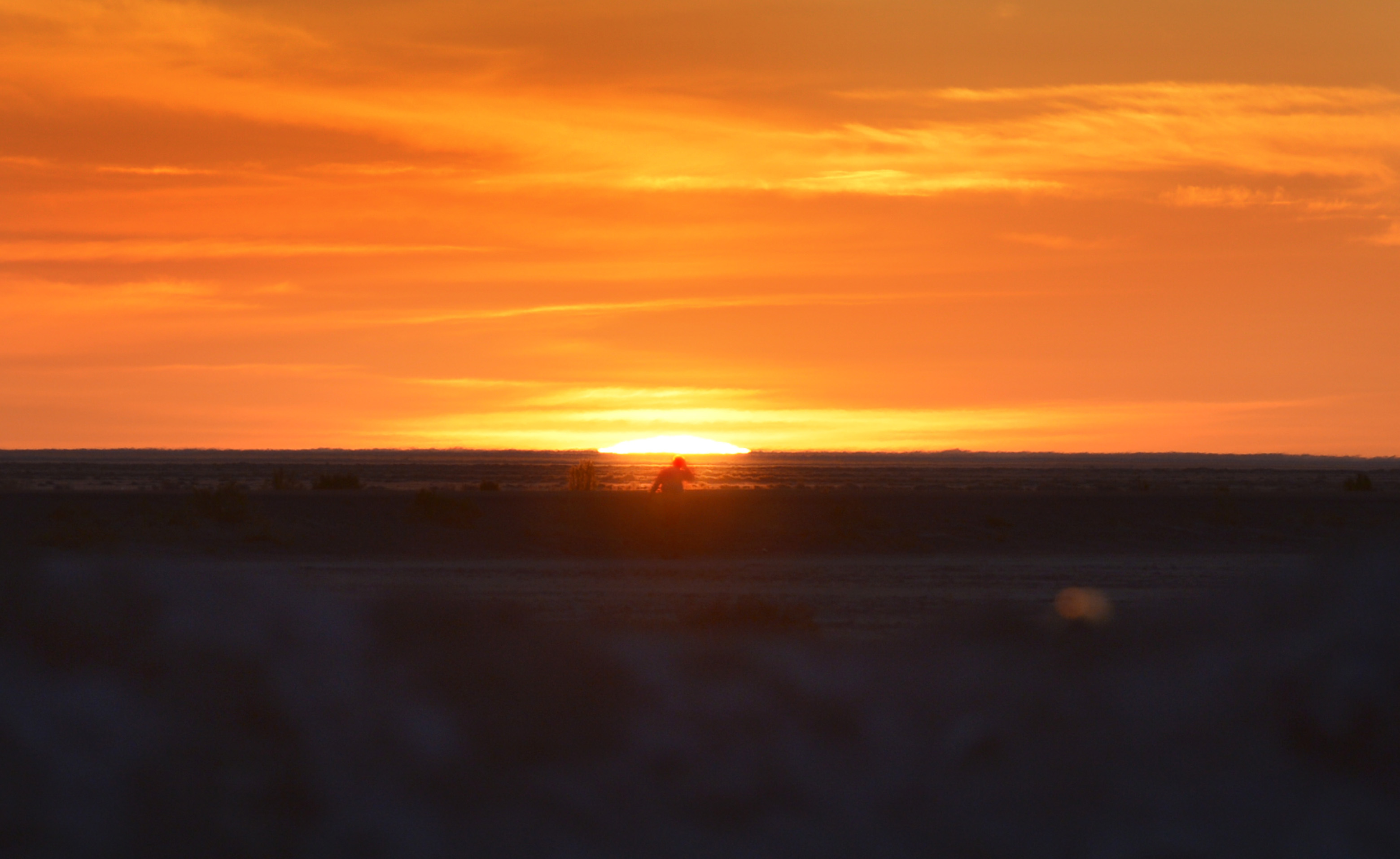 (Scott Sommerdorf | The Salt Lake Tribune) Alex Doolan sets out on the last 3.8 miles as the sun rises at the Salt Flats 100 Endurance Run, Saturday, May 5, 2018. Doolan finished the race in 8th place. 