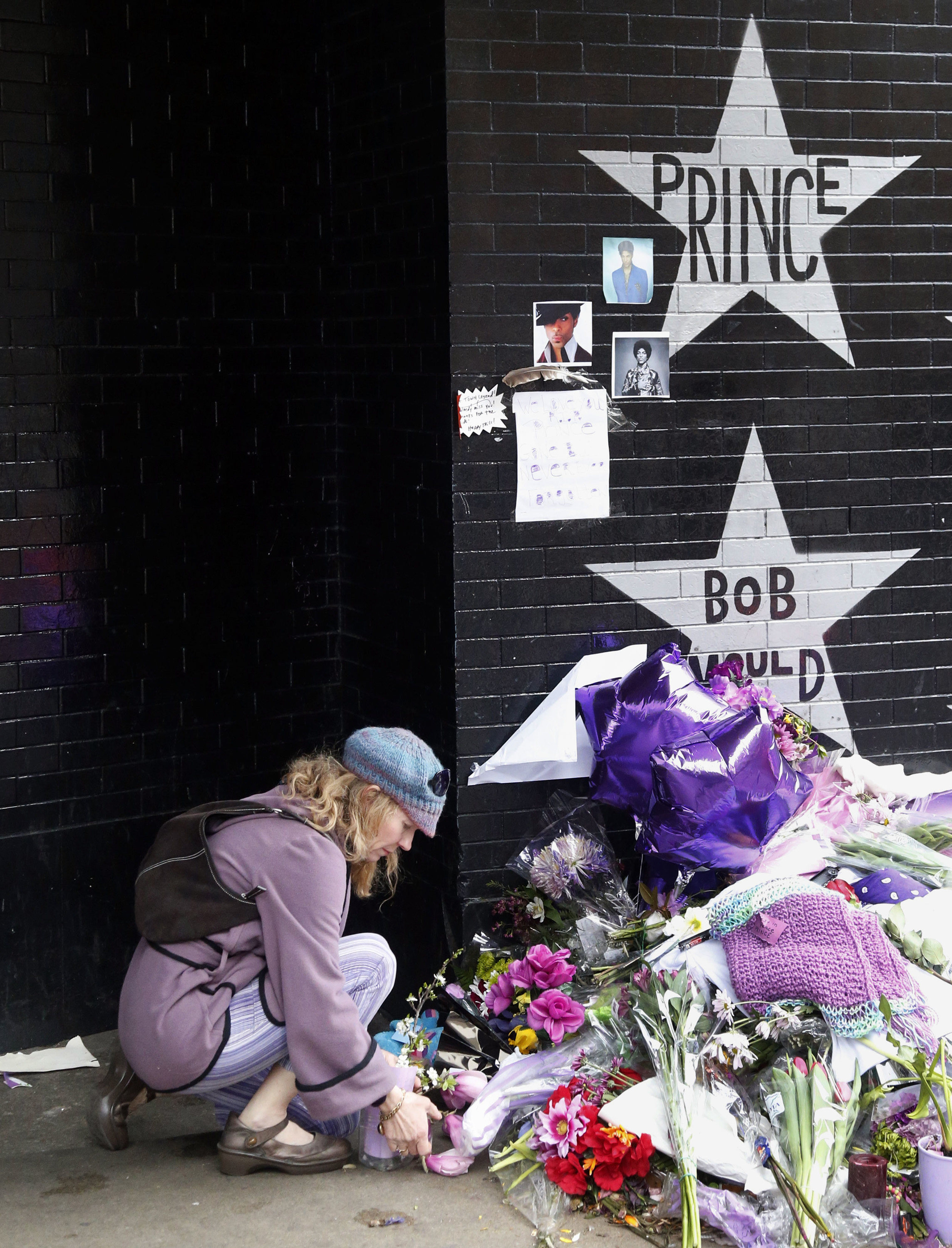 With tears, tattoos, Prince fans remember him a year later