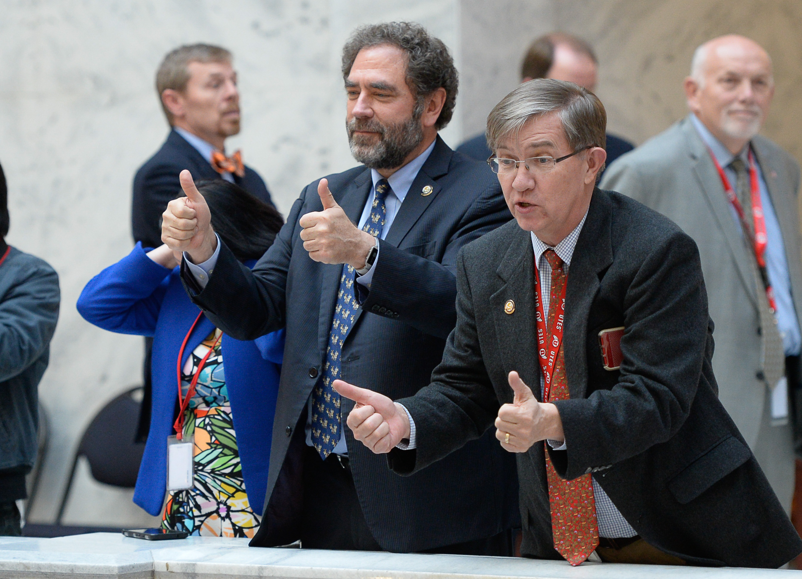 (Francisco Kjolseth | The Salt Lake Tribune) Rep. Brian King, D-Salt Lake, left, and Rep. Joe Briscoe, D-Salt Lake, give the thumbs up to demonstrators gathered at the Capitol rotunda on Monday, Jan, 28, 2019, on the first day of the Legislative session to rally in support of protecting Proposition 3, the Medicaid Expansion law recently passed by voters.