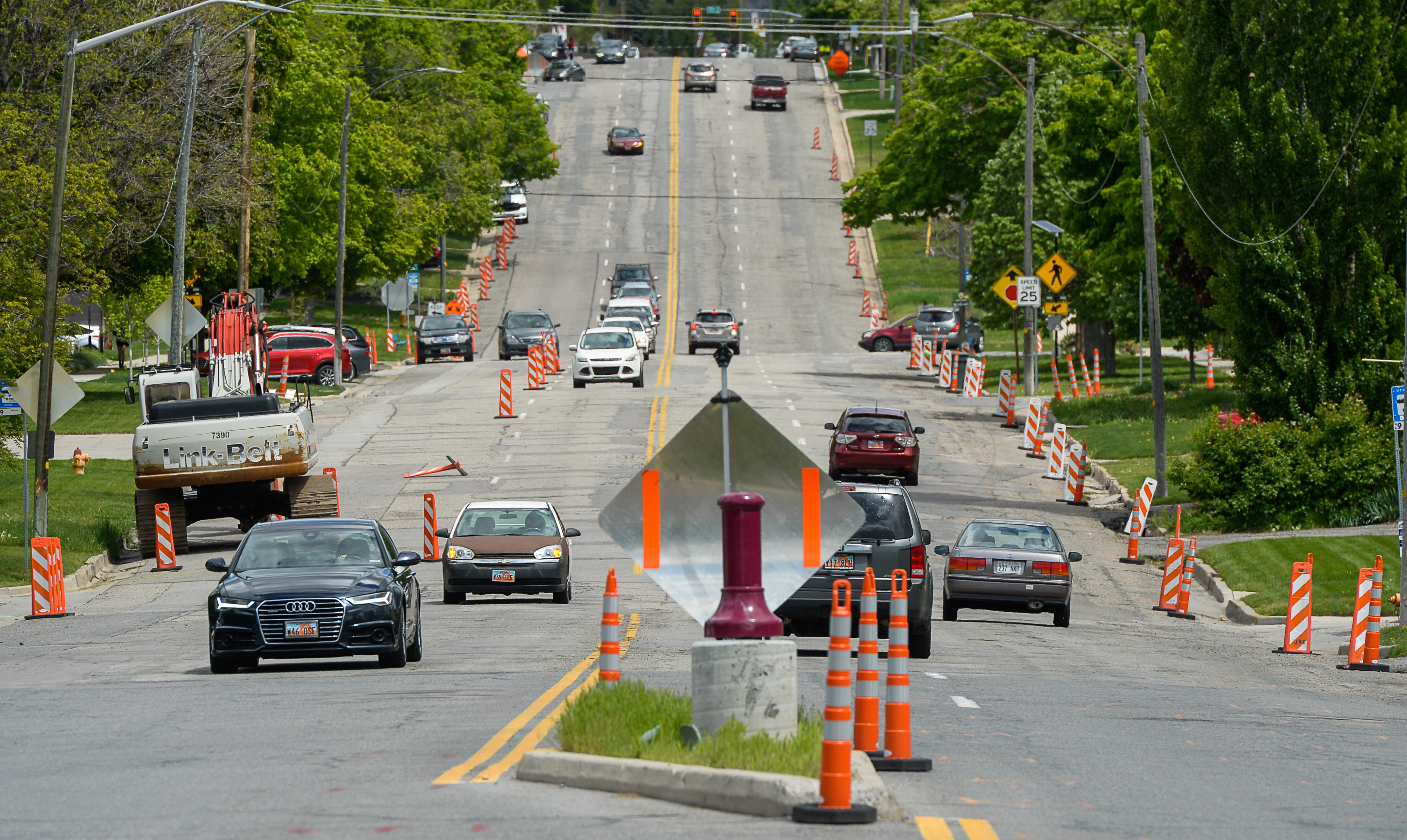 (Francisco Kjolseth | The Salt Lake Tribune) Traffic moves along a sea of orange as plans to repurpose 29 parking spaces between 950 East and 1300 East on 900 South in Salt Lake City causes some frustration from business owners and residents in the area.