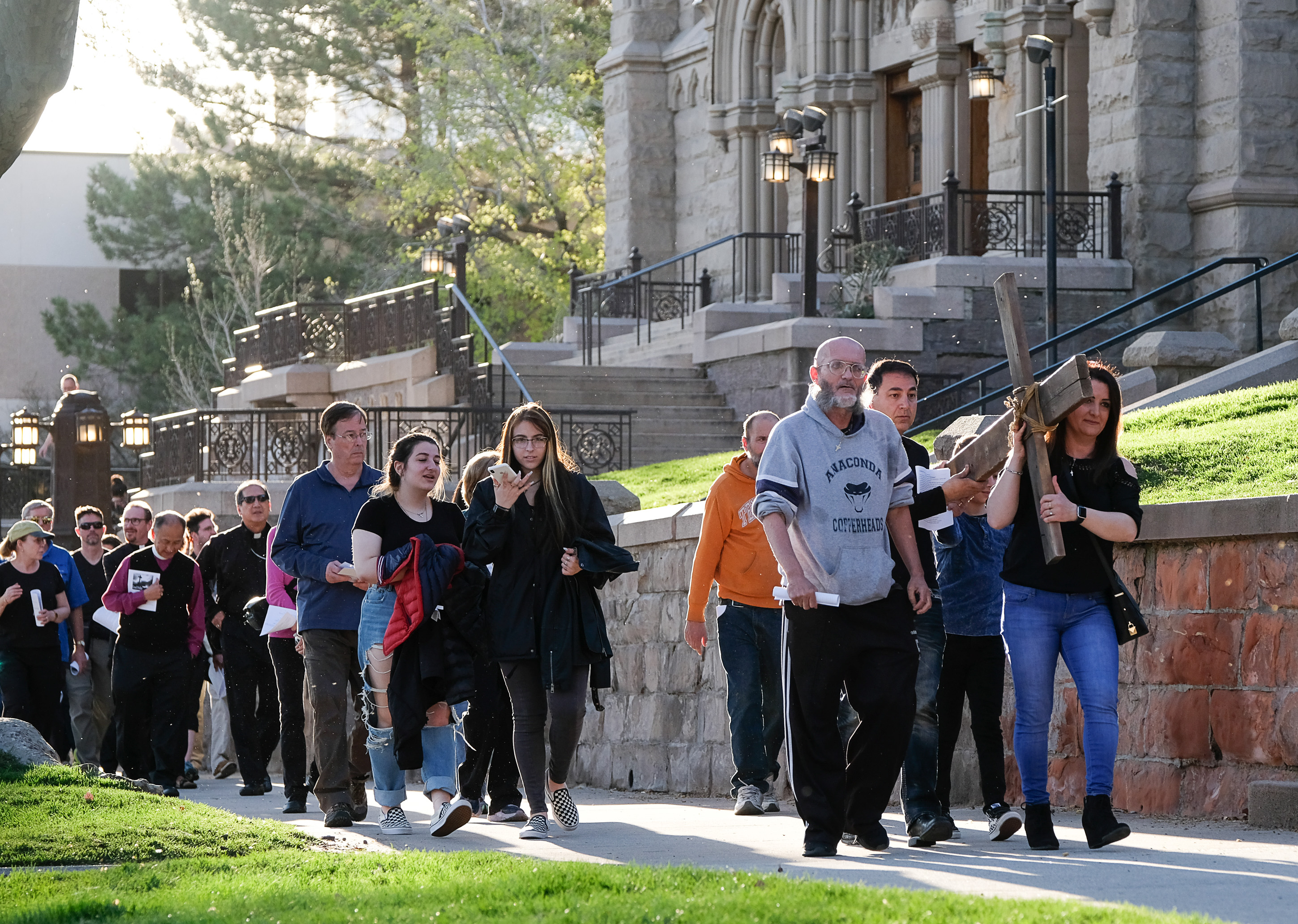 (Francisco Kjolseth | The Salt Lake Tribune) Christians march through streets of Salt Lake City on Good Friday to symbolically mark Jesus' carrying the cross to his crucifixion beginning at Cathedral of the Madeleine.