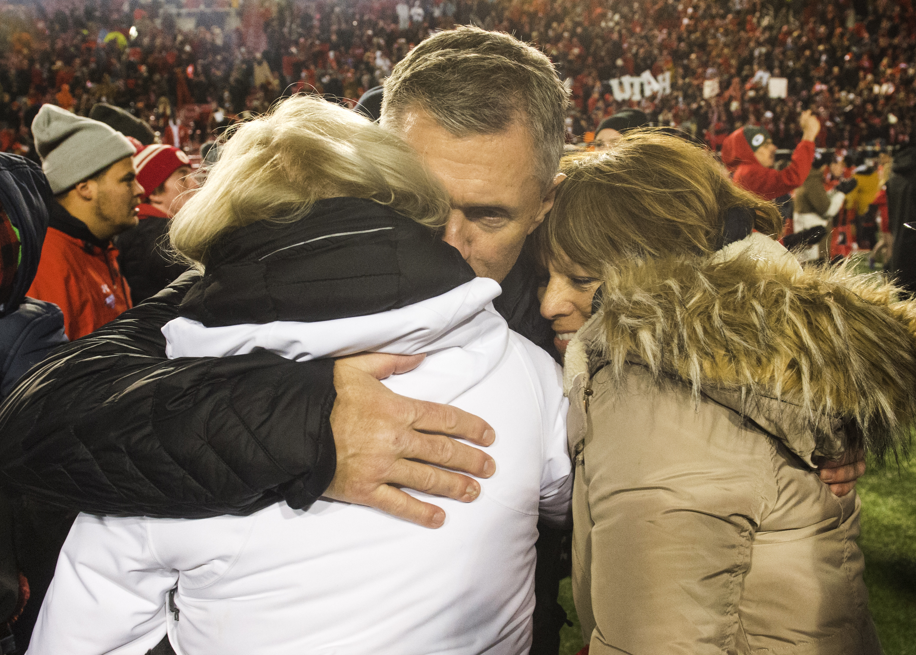 (Rick Egan | The Salt Lake Tribune) Utah Utes head coach Kyle Whittingham hugs family members, after Utah defeated BYU for the 8th straight time, in football action between the Brigham Young Cougars and the Utah Utes, at Rice-Eccles Stadium, Saturday, November 24, 2018. 