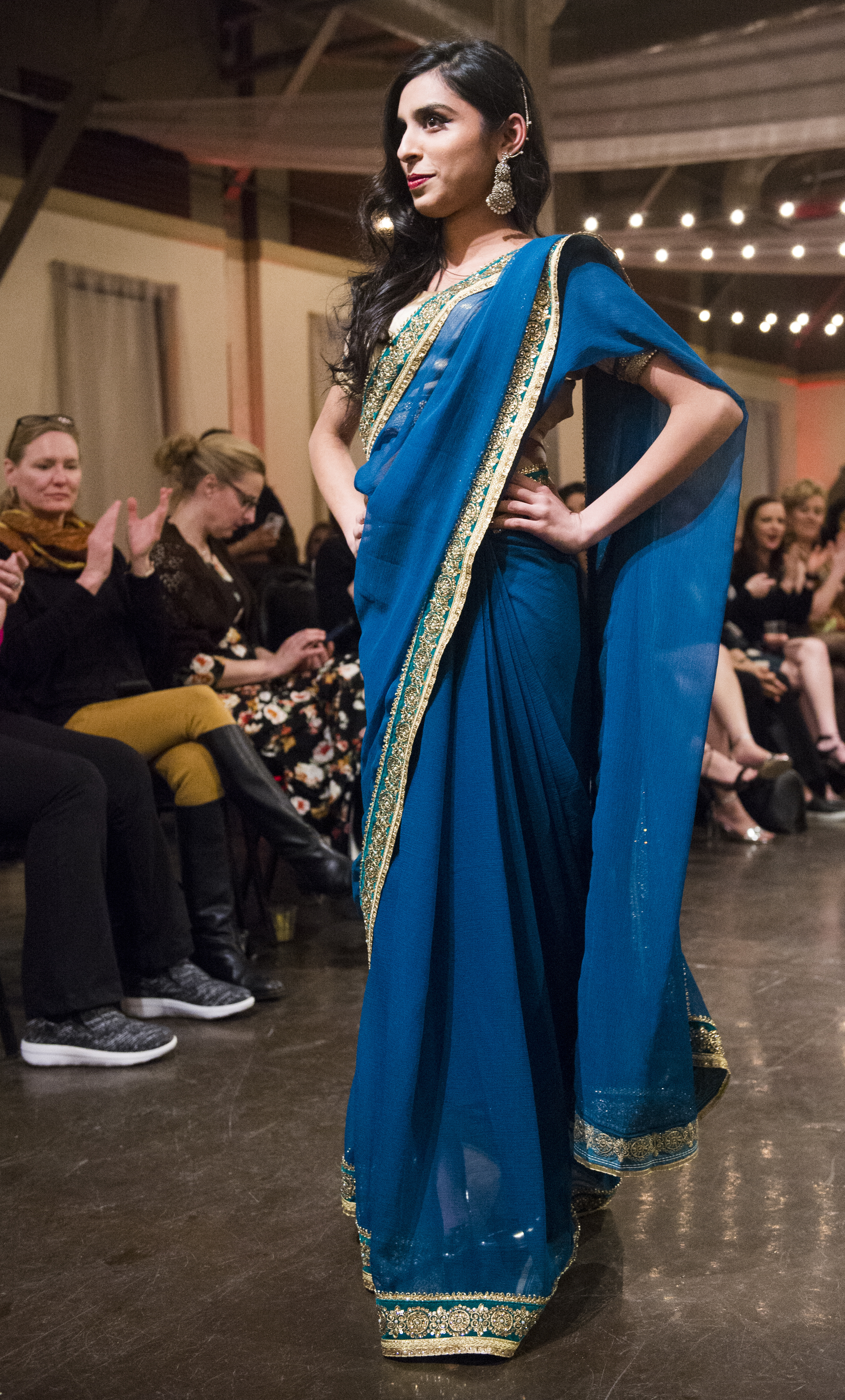 (Rick Egan | The Salt Lake Tribune) Mesha models a dress from Pakistan at the 8th Annual Women of the World Fashion Show. The fashion show fund is raiser for the non-profit that seeks to help refugees settle in a new culture. Wednesday, March 7, 2018. 