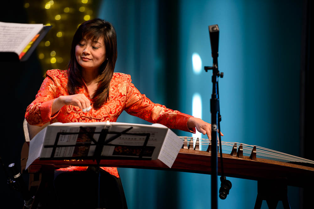 (Trent Nelson | The Salt Lake Tribune) Yun Layton plays the guzheng with the Utah Chinese Folk Orchestra performs at the Chinese New Year Celebration at the County Library's Viridian Event Center in West Jordan, Saturday Feb. 17, 2018.