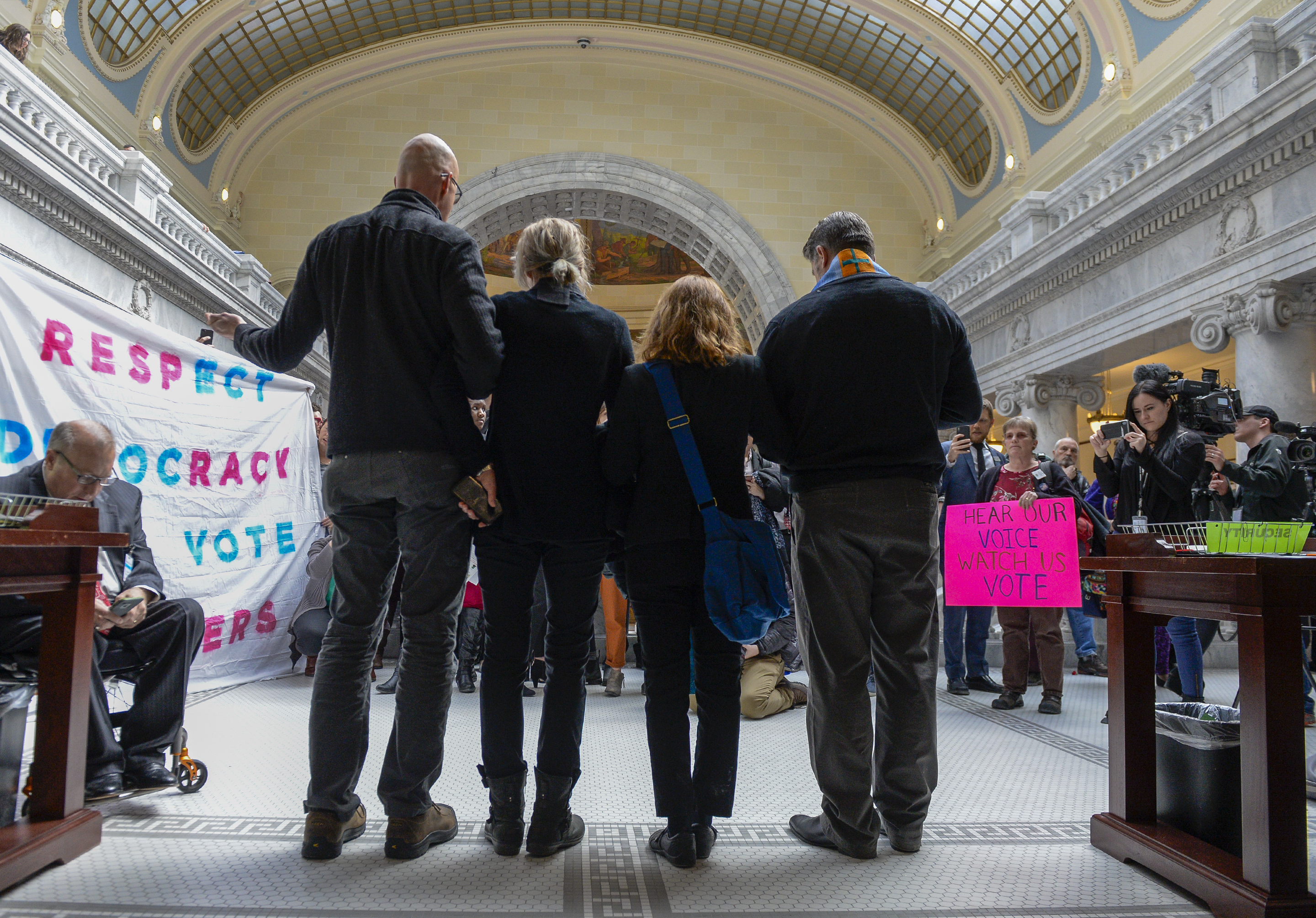 Leah Hogsten | The Salt Lake Tribune Faith leaders r-l Rev. Curtis Price with The First Baptist Church of Salt Lake City, Rev. Monica Dobbins with the First Unitarian Church of Salt Lake City, Zen Buddhist Anna Zumwalt and Pastor David Nichols with Mt. Tabor Lutheran Church demonstrate in opposition to SB96 outside the Utah House chambers, Feb. 8, 2019. 