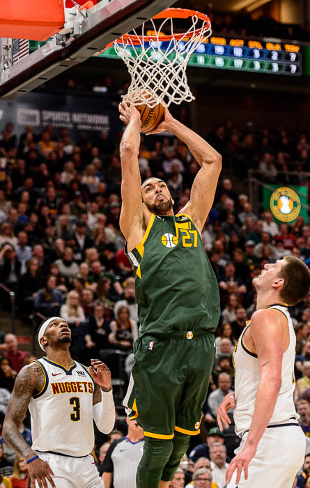 (Trent Nelson | The Salt Lake Tribune) Utah Jazz center Rudy Gobert (27) dunks over Denver Nuggets center Nikola Jokic (15) as the Utah Jazz host the Denver Nuggets, NBA basketball in Salt Lake City on Wednesday Jan. 23, 2019.