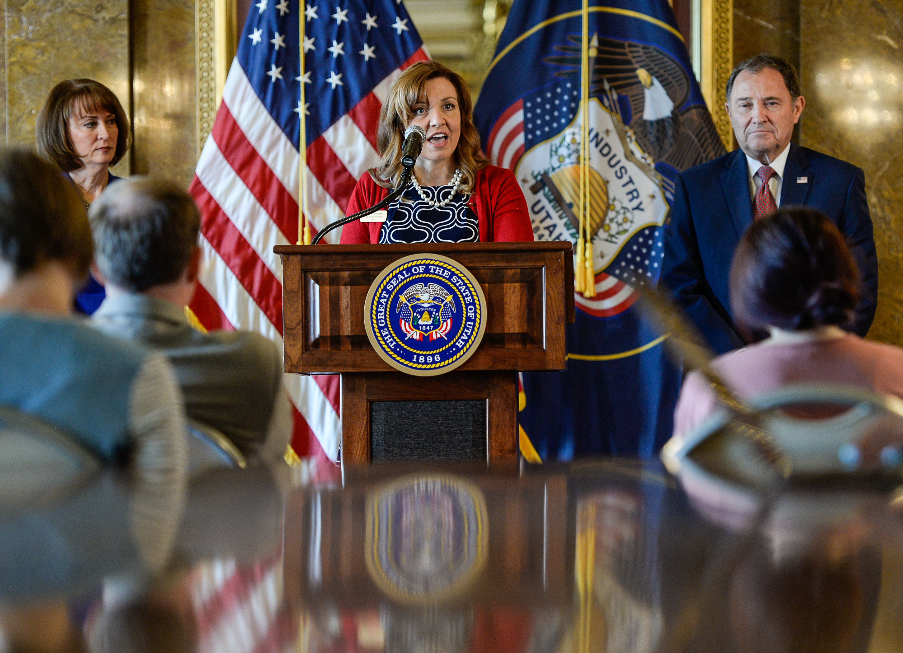 (Francisco Kjolseth | The Salt Lake Tribune) Aaryn Birchell, 2017-2018 Utah Teacher of the Year, center, is joined by Sydnee Dickson, State Superintendent of Public Instruction and Governor Gary Herbert at the Utah Capitol as they discuss UtahÕs teacher shortage and issue a call for more teachers during a press event on Wed. Sept. 12, 2018. 