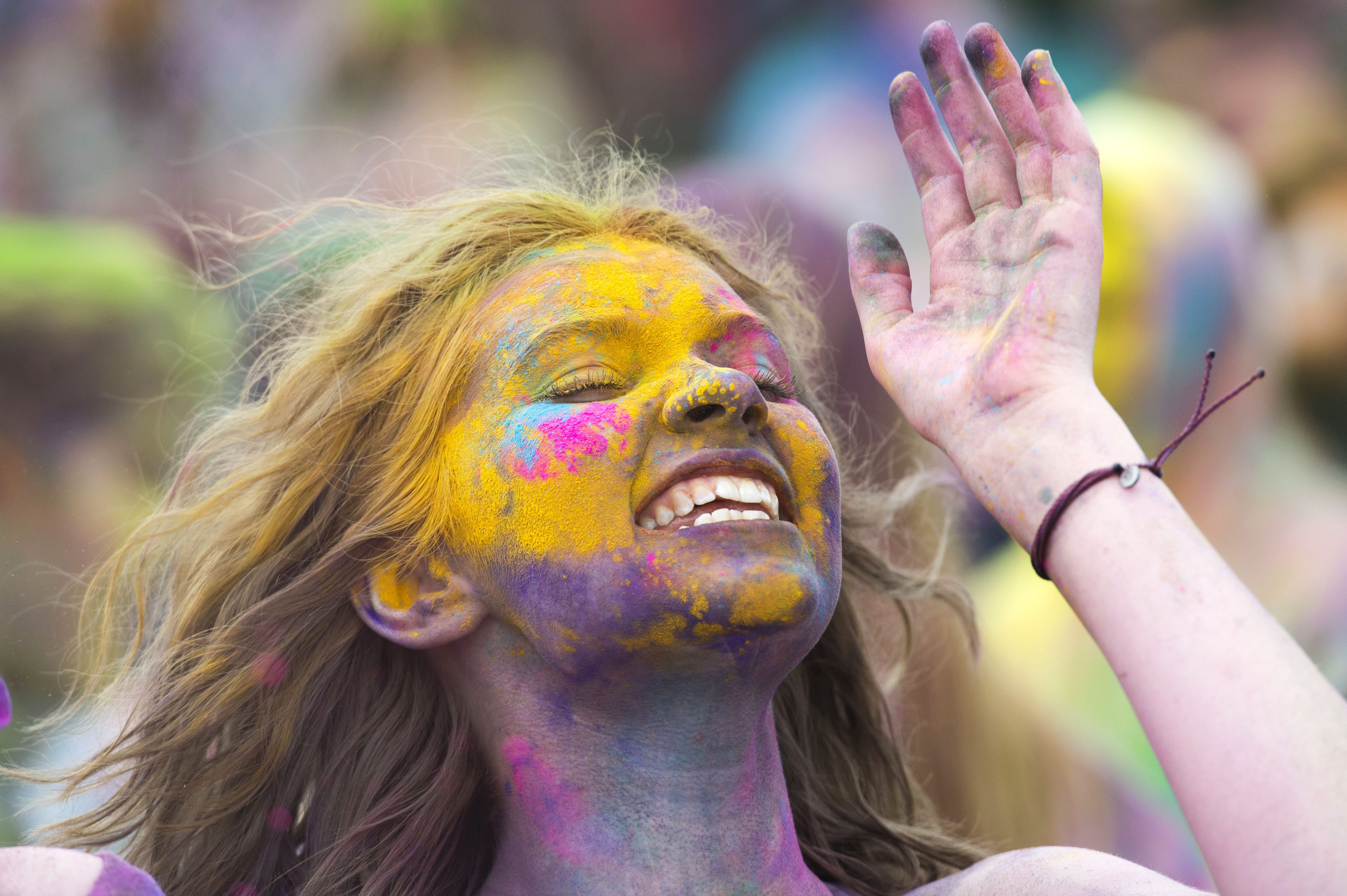 (Rick Egan | The Salt Lake Tribune) Adalaide Bailey, from Pocatello Idaho cheers along with the band, during the Holi Festival of Colors celebration at the Sri Sri Radha Krishna Temple in Spanish Fork, Saturday, March 30, 2019. 