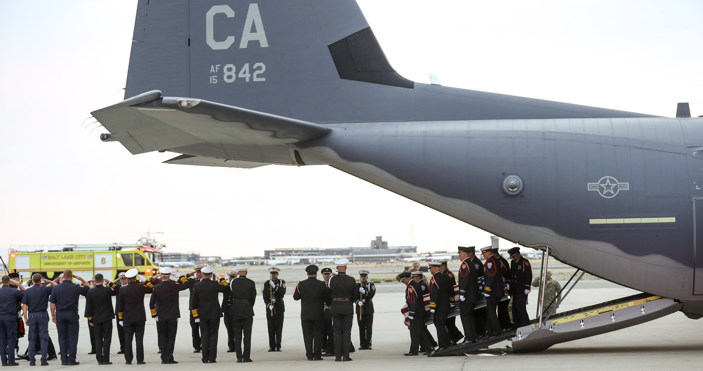 (Steve Griffin | Deseret News, pool photo) Members of the Draper City Fire Department and Unified Fire Authority Honor Guard carry the casket of Draper Battalion Chief Matt Burchett to a hearse after being transported from California to Utah in a C130-J by the California Air National Guard. The C130-J landed at the Utah Air National Guard Base in Salt Lake City on Wednesday, Aug. 15, 2018. Burchett was killed while fighting the Mendocino Complex Fire north of San Francisco.