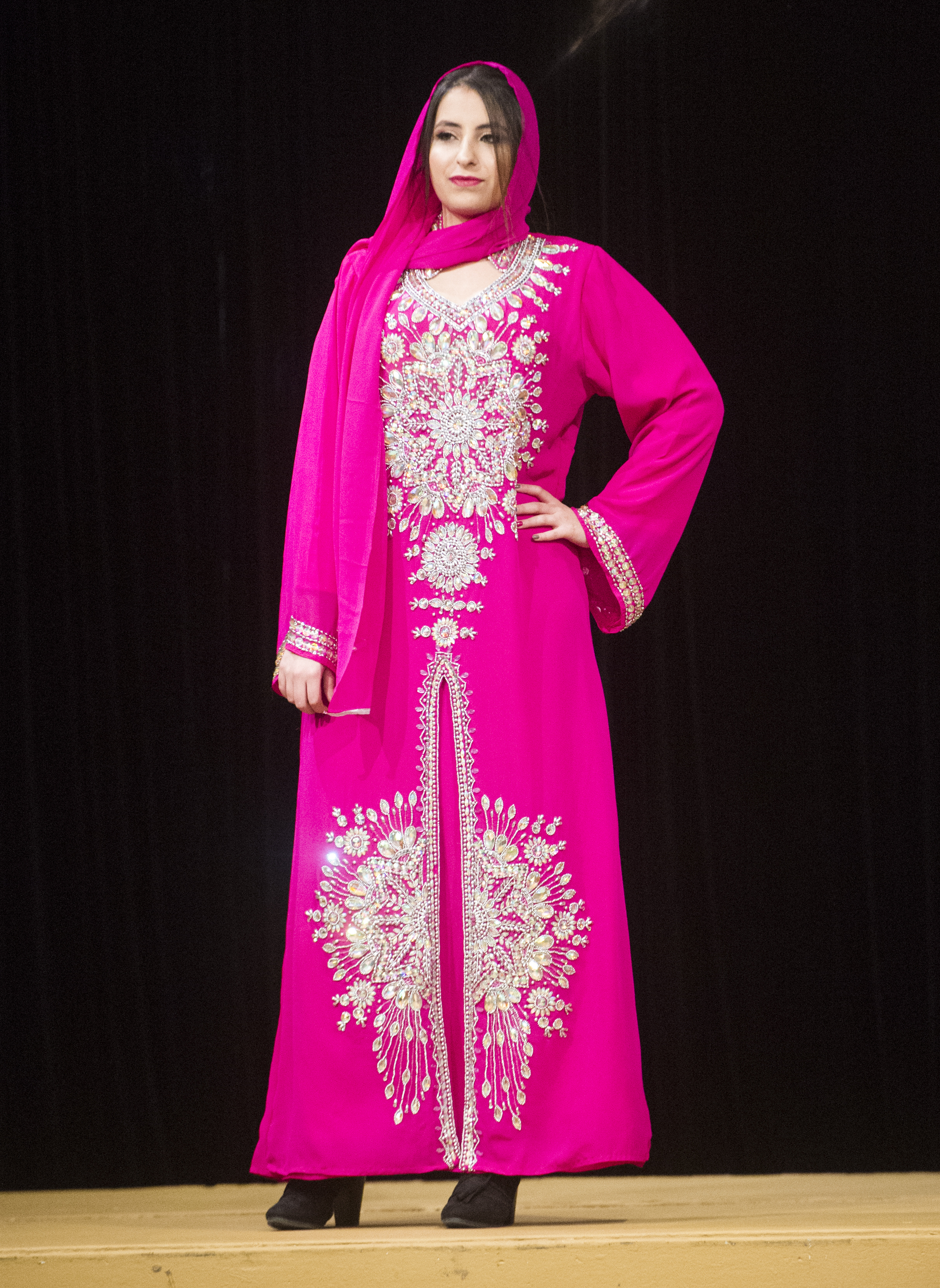 (Rick Egan | The Salt Lake Tribune) Reem models an outfit from Iraq, at the 8th Annual Women of the World Fashion Show. The fashion show fund is raiser for the non-profit that seeks to help refugees settle in a new culture. Wednesday, March 7, 2018. 