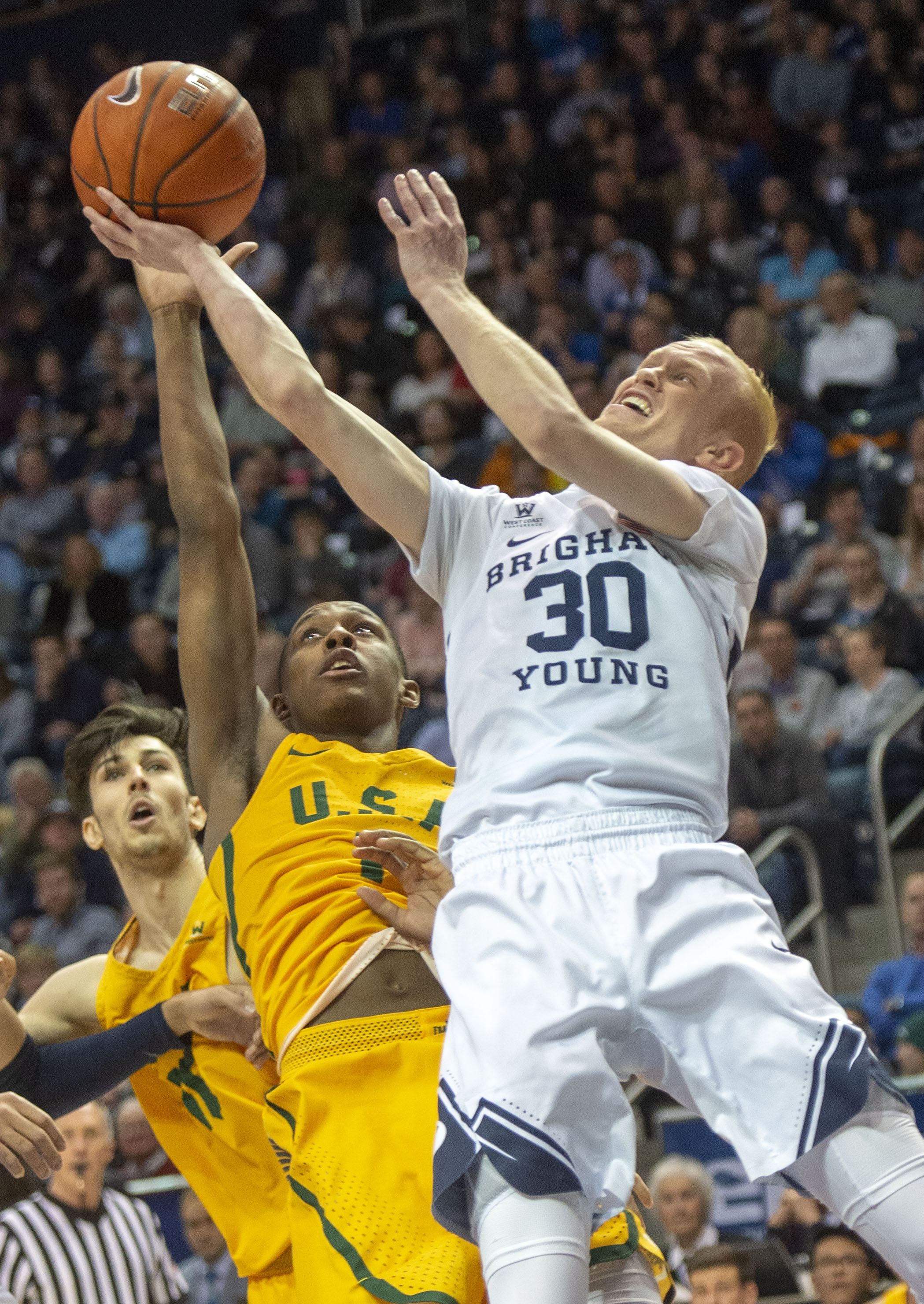(Rick Egan | The Salt Lake Tribune) Brigham Young Cougars guard TJ Haws (30) takes a shot as San Francisco Dons guard Jamaree Bouyea (1), in WCC basketball action at the Marriott Center, Thursday, February 21, 2018. 