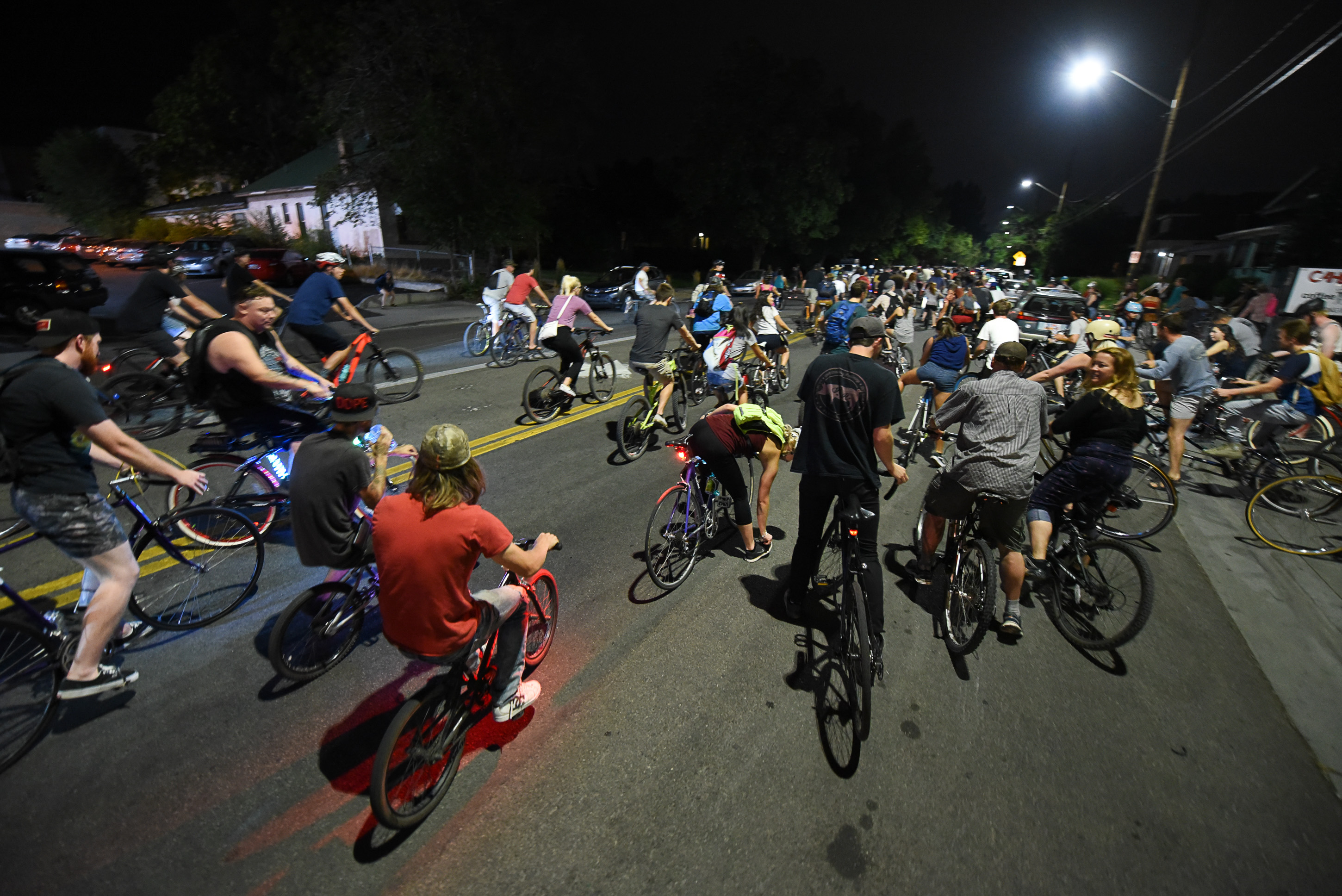 (Francisco Kjolseth | The Salt Lake Tribune) A large group of cyclist begins their ride from the corner of 9th and 9th after gathering after 9pm in Salt Lake City on Thursday, July 26, 2018, for the weekly ride that has become known as the 999 Ride. The inclusive, all-welcoming slow casual social ride happens year round on Thursday nights, with riders often pedaling into the early morning hours. Newly released video shows rider Cameron Hooyer being struck and killed by a FrontRunner train at a downtown railroad crossing during last weeks ride when the 22-year-old failed to stop or heed the warning signals before crossing the tracks during the group ride. 