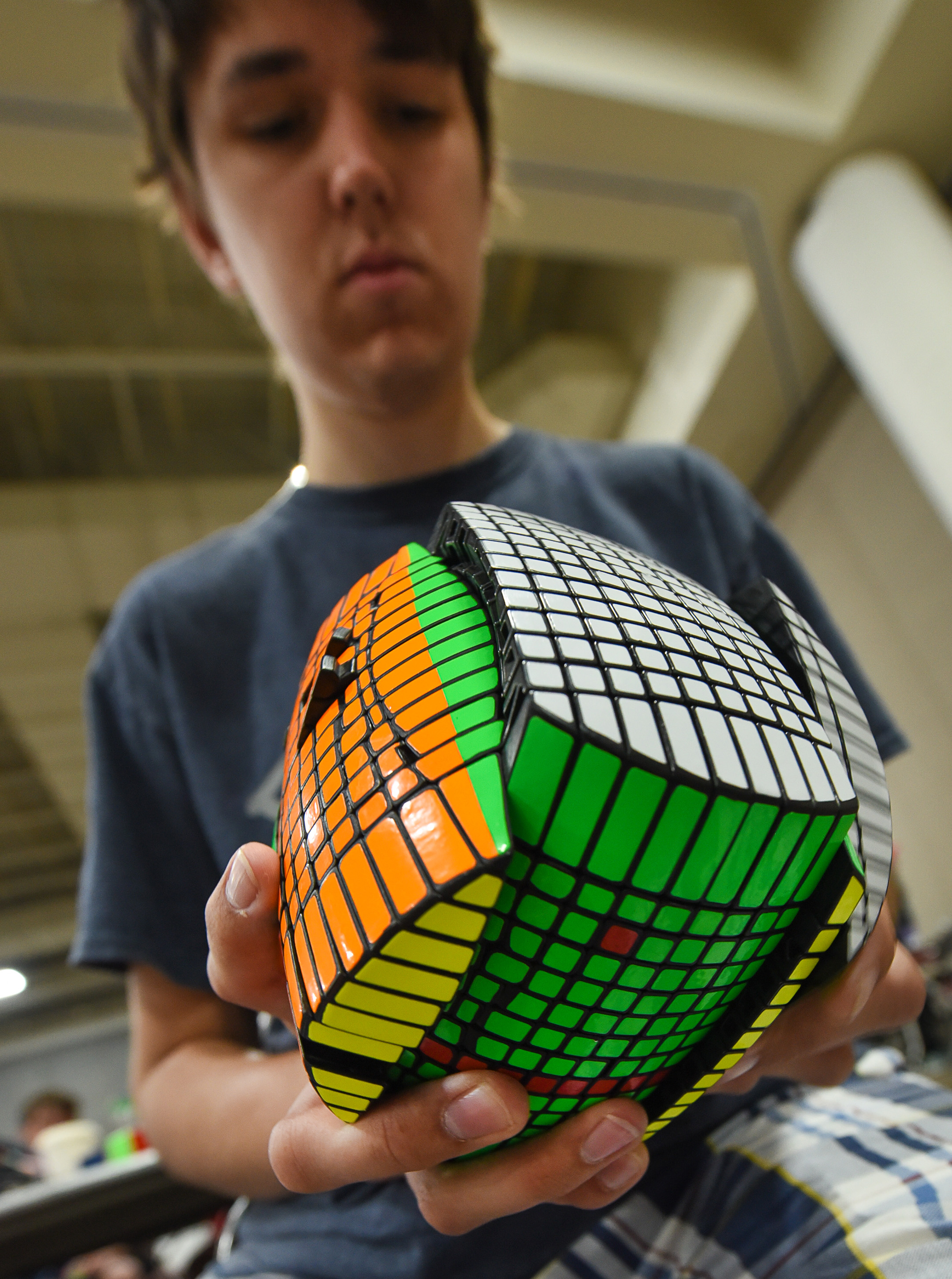 (Francisco Kjolseth | The Salt Lake Tribune) Damian Wilding, 19, of Idaho Falls works on his "one of a kind" 13x13 barrel that took him an entire summer to create using various tools as he attends CubingUSA Nationals 2018 at the Salt Palace Convention Center in Salt Lake City on Saturday, July 28, 2018. 