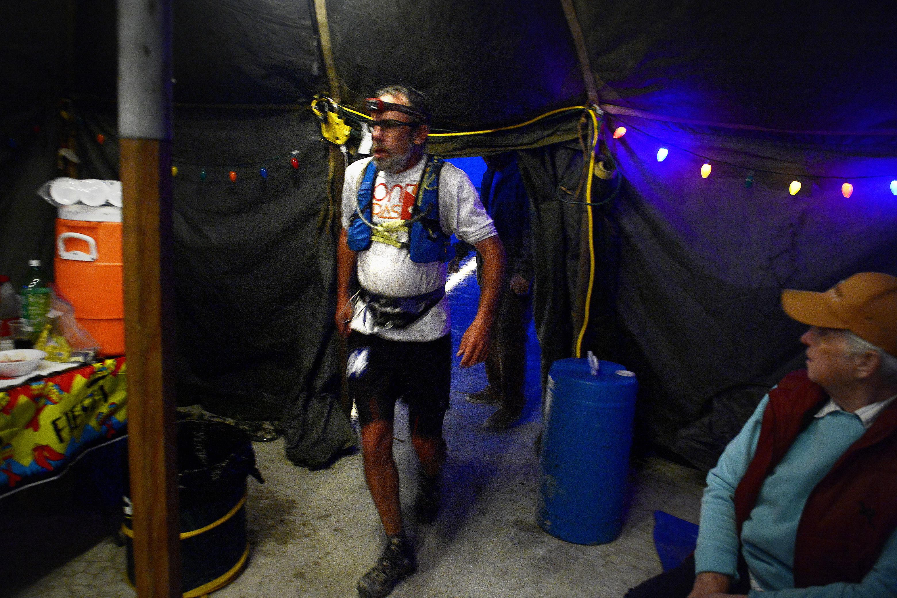 (Scott Sommerdorf | The Salt Lake Tribune) Seventh place finisher Todd Vogel enters and passes through Aid Station 14 - the last checkpoint before the finish line - at the Salt Flats 100 Endurance Run, Saturday, May 5, 2018. 