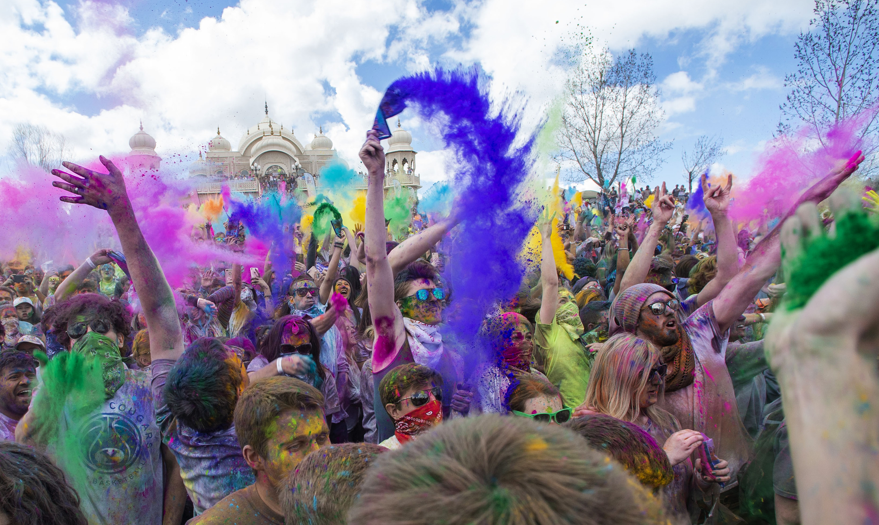 (Rick Egan | The Salt Lake Tribune) Revelers toss colored powder into the air as they celebrate the arrival of spring, during the Holi Festival of Colors celebration at the Sri Sri Radha Krishna Temple in Spanish Fork, Saturday, March 30, 2019. 