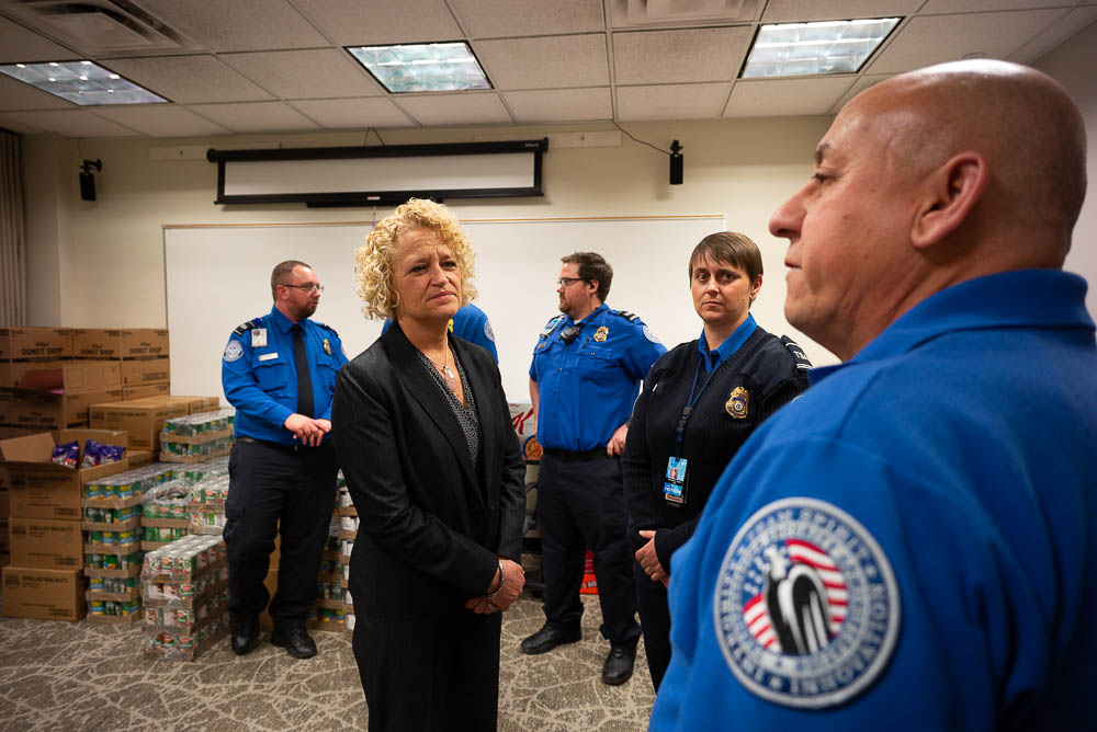 (Trent Nelson | The Salt Lake Tribune) Salt Lake City Mayor Jackie Biskupski speaks to TSA employee after having pizza delivered to TSA and other federal employees to thank them for working at the airport without pay during the partial federal shutdown on Tuesday Jan. 22, 2019. Food from the Utah Food Pantry was stacked around the training room to cover the needs of employees. From left are Ed Puhlmann, Biskupski, Anthony Christensen, Woodrina Berg, and Ronald Glujan.