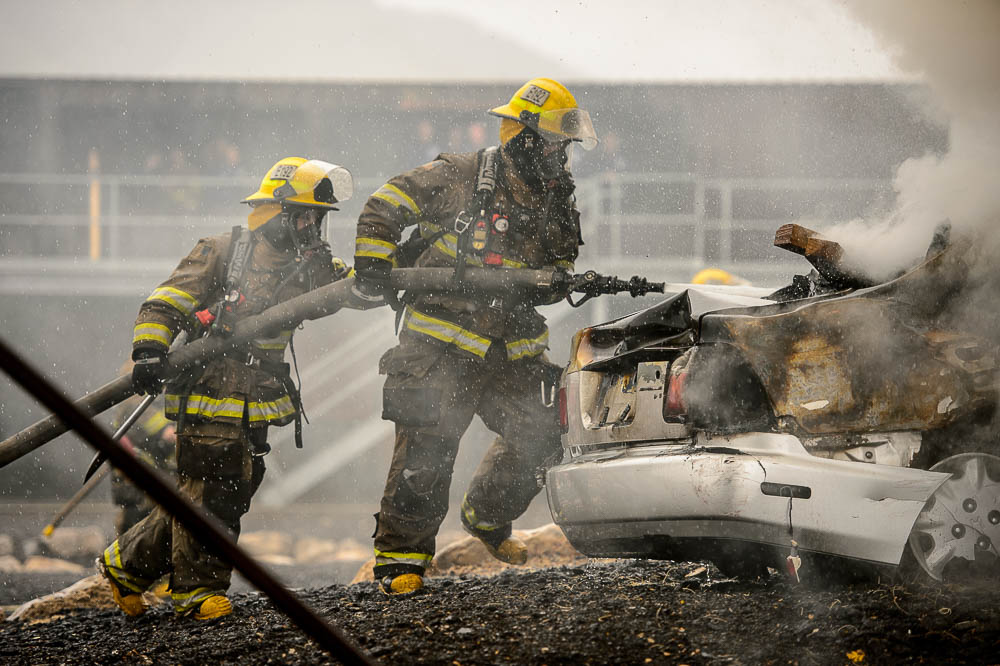(Trent Nelson | The Salt Lake Tribune) Unified Fire recruits in a live response to a vehicle and structure fire at the Unified Fire Authority Training Center in Magna on Tuesday April 16, 2019.