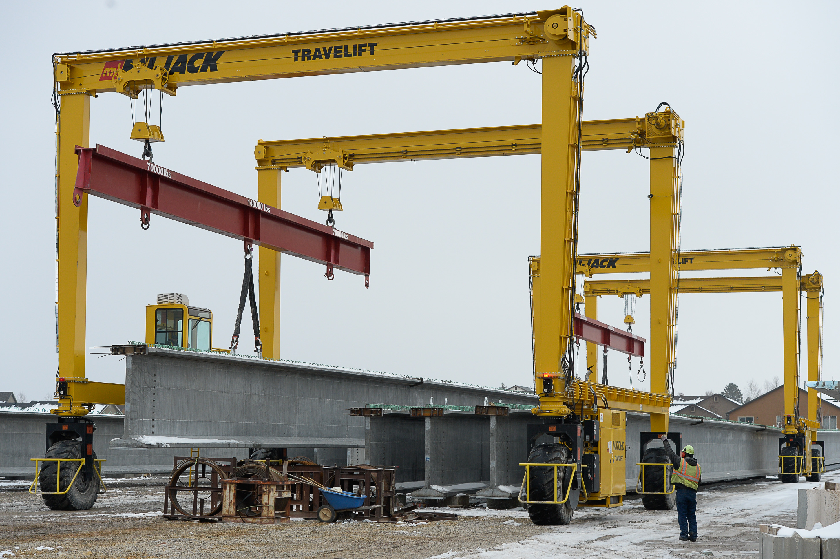 (Francisco Kjolseth | The Salt Lake Tribune) UDOT gets ready to place some of the world's largest-ever bridge beams, and the largest in Utah state history with a span of 203 ft long and just over 8 ft tall, as crews use a special driving lift to load one on a truck following manufacturing at Forterra Structural Precast in Kearns on Tuesday, Dec. 11, 2018. A total of six beams will be installed in the technology corridor in Lehi later this week.