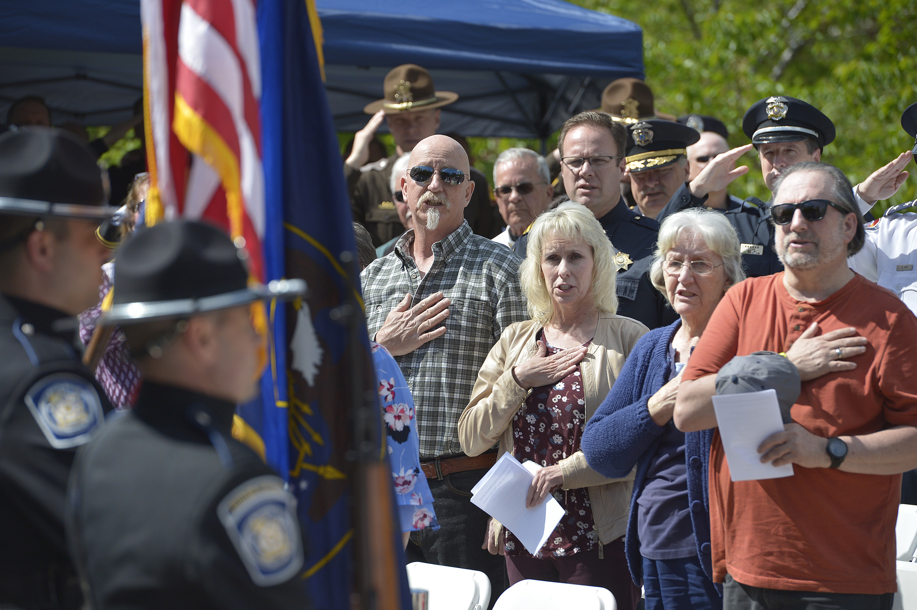 (Scott Sommerdorf | The Salt Lake Tribune) As the colors were posted, attendees stood as they gathered to honor the 142 Utah police officers killed in the line of duty during the state's history, Thursday, May 3, 2018. No Utah law enforcement officer died in the line of duty last year.