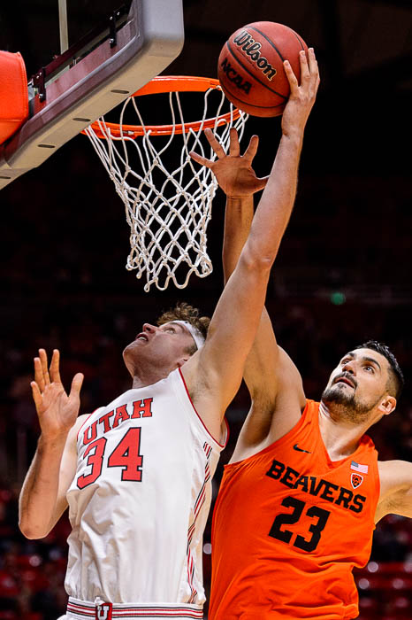 (Trent Nelson | The Salt Lake Tribune) Utah Utes center Jayce Johnson (34) shoots, defended by Oregon State Beavers center Gligorije Rakocevic (23) as Utah hosts Oregon State, NCAA basketball in Salt Lake City on Saturday Feb. 2, 2019.