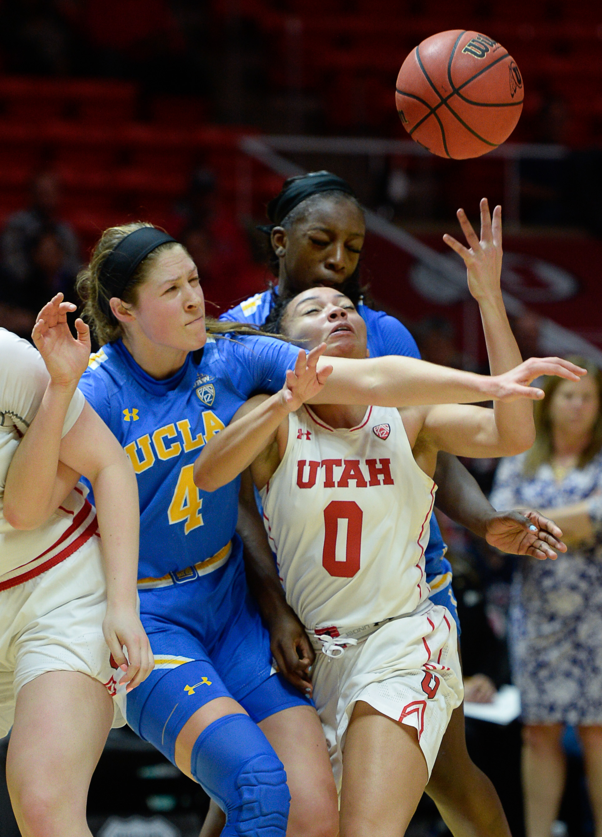 (Francisco Kjolseth | The Salt Lake Tribune) UCLA Bruins guard Lindsey Corsaro (4) blocks Utah Utes guard Kiana Moore (0) at the Jon M. Huntsman Center in Salt Lake City on Sunday, Feb. 10, 2019.