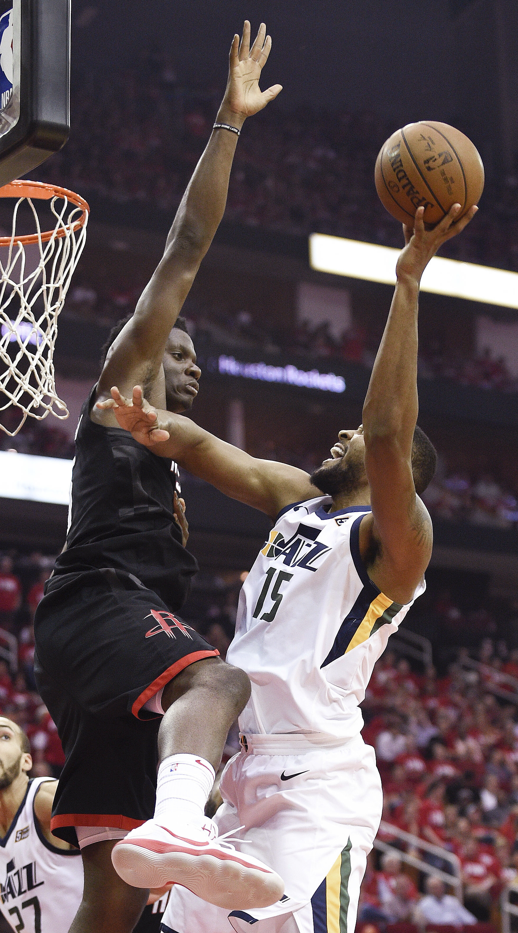 Utah Jazz forward Derrick Favors (15) shoots as Houston Rockets center Clint Capela defends during the second half in Game 2 of an NBA basketball second-round playoff series Wednesday, May 2, 2018, in Houston. (AP Photo/Eric Christian Smith)