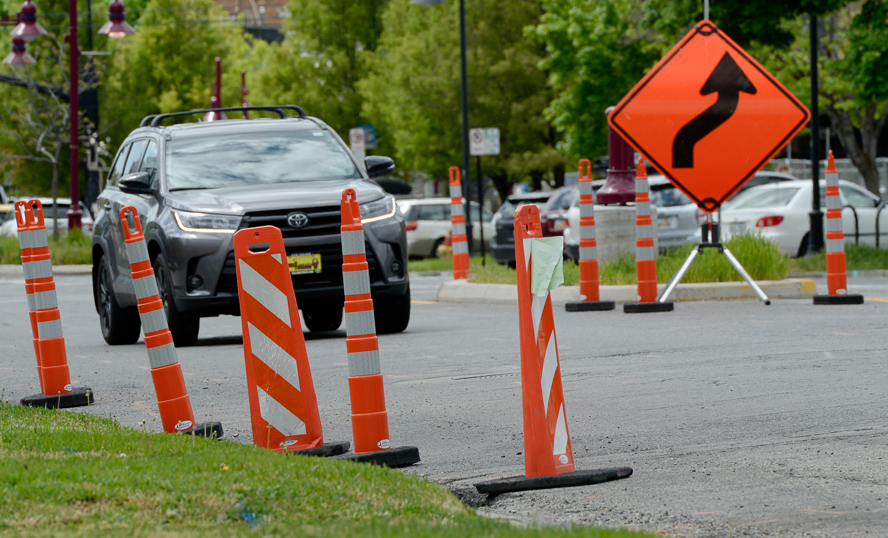 (Francisco Kjolseth | The Salt Lake Tribune) Traffic moves along a sea of orange as plans to repurpose 29 parking spaces between 950 East and 1300 East on 900 South in Salt Lake City causes some frustration from business owners and residents in the area.