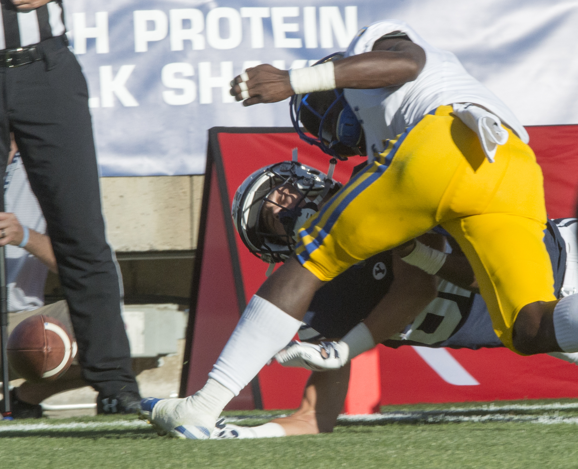 (Rick Egan | The Salt Lake Tribune) Holker (32) gets hit hard by McNeese State Cowboys defensive back Jovon Burriss (5), but was not called for targeting after the replay, in football action Brigham Young Cougars vs McNeese State Cowboys at Lavell Edwards Stadium, Saturday, Sept. 22, 2018. 