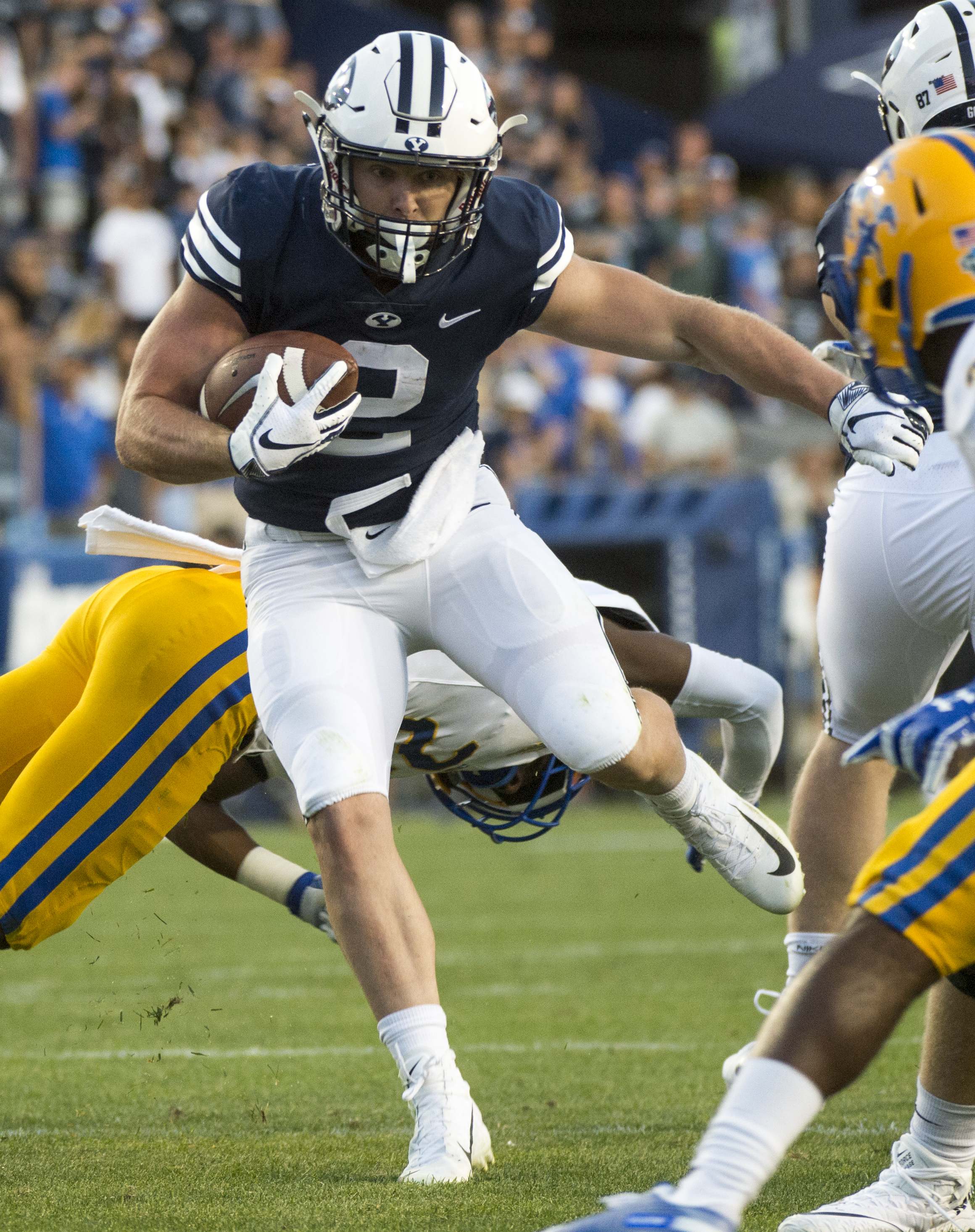 (Rick Egan | The Salt Lake Tribune) Brigham Young Cougars running back Matt Hadley (2) runs the ball as McNeese State Cowboys defensive back Andre Sam (21) defends, in football action Brigham Young Cougars vs McNeese State Cowboys at Lavell Edwards Stadium, Saturday, Sept. 22, 2018. 