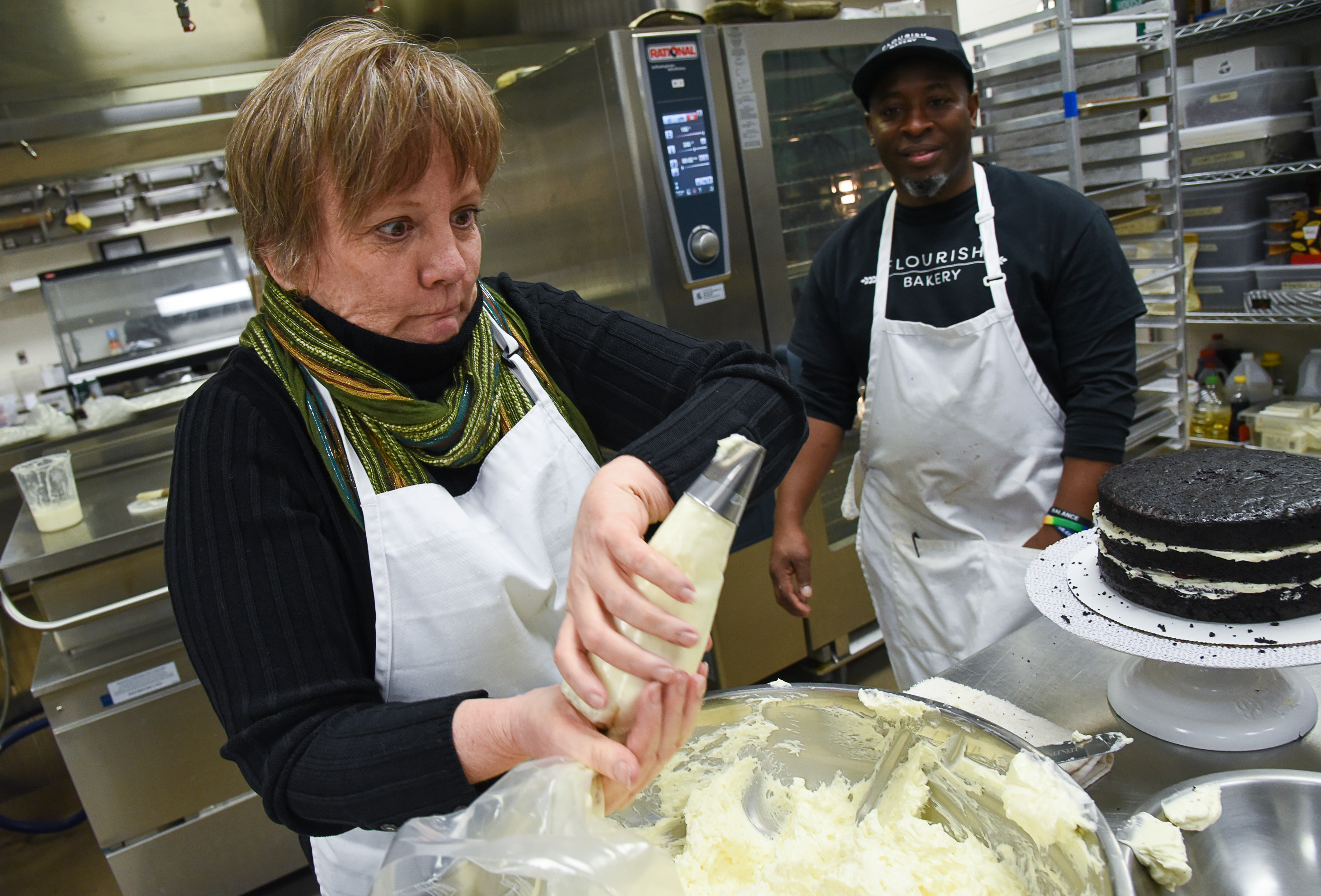 (Francisco Kjolseth | The Salt Lake Tribune) Actress Betsy West has fun in the kitchen alongside Frederick Jackson as she prepares for an upcoming role of a Southern Baptist bakery owner in North Carolina faced with a request to bake a cake for a gay couple getting married for Salt Lake Acting Company's production of "The Cake." A self admitted baking novice, West, in search of better authenticity in portraying her role received a one-on-one lesson from the chef's at Flourish Bakery.