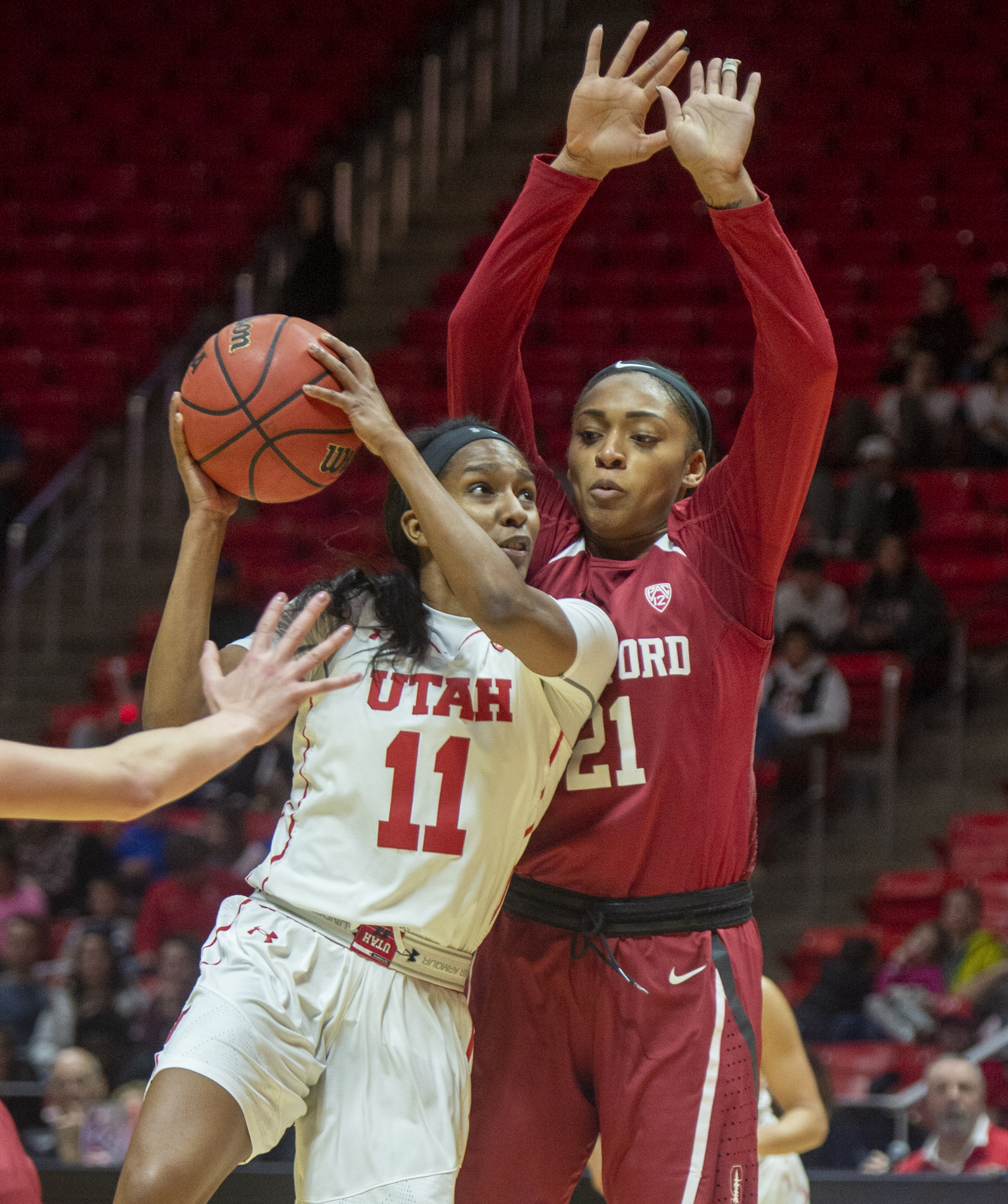 (Rick Egan | The Salt Lake Tribune) Utah Utes guard Erika Bean (11) looks for a shot as Stanford Cardinal guard DiJonai Carrington (21) defneds, in PAC-12 action between the Utah Utes and the Stanford Cardinals at the Jon M. Huntsman Center. Sunday, Jan. 27, 2019. 