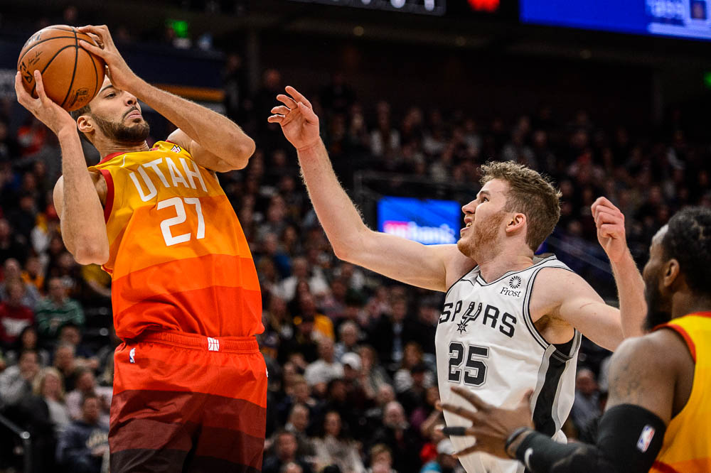 (Trent Nelson | The Salt Lake Tribune) Utah Jazz center Rudy Gobert (27) rebounds ahead of San Antonio Spurs center Jakob Poeltl (25) as the Utah Jazz host the San Antonio Spurs, NBA basketball in Salt Lake City on Saturday Feb. 9, 2019.